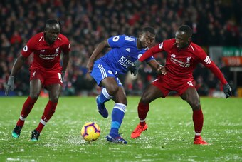 LIVERPOOL, ENGLAND - JANUARY 30:  Nampalys Mendy of Leicester City takes on Naby Keita and Sadio Mane of Liverpool during the Premier League match between Liverpool FC and Leicester City at Anfield on January 30, 2019 in Liverpool, United Kingdom.  (Photo