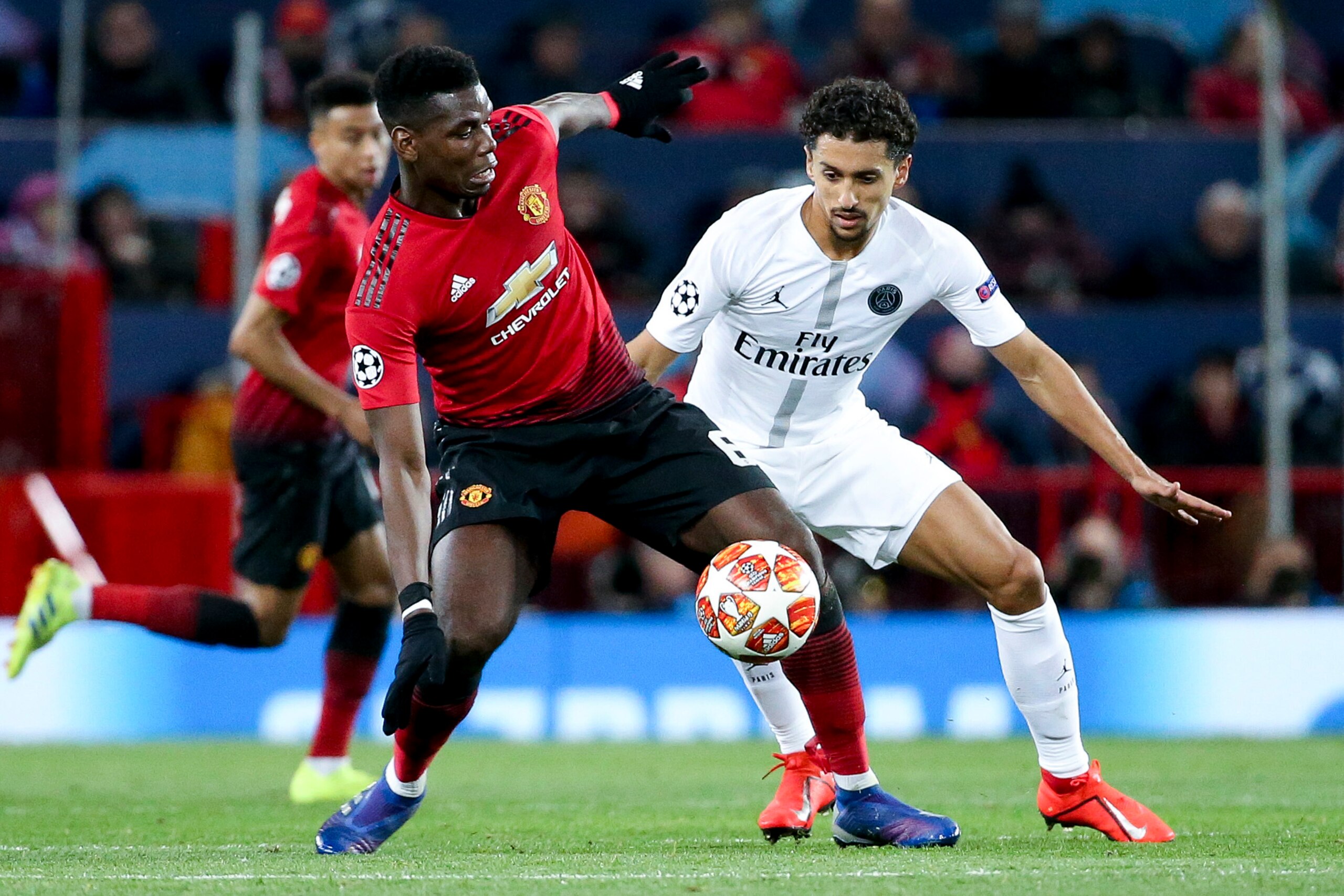 MANCHESTER, ENGLAND - FEBRUARY 12: Paul Pogba of Manchester United, Marquinhos of PSG during the UEFA Champions League Round of 16 First Leg match between Manchester United (Man U) and Paris Saint-Germain (PSG) at Old Trafford stadium on February 12, 2019