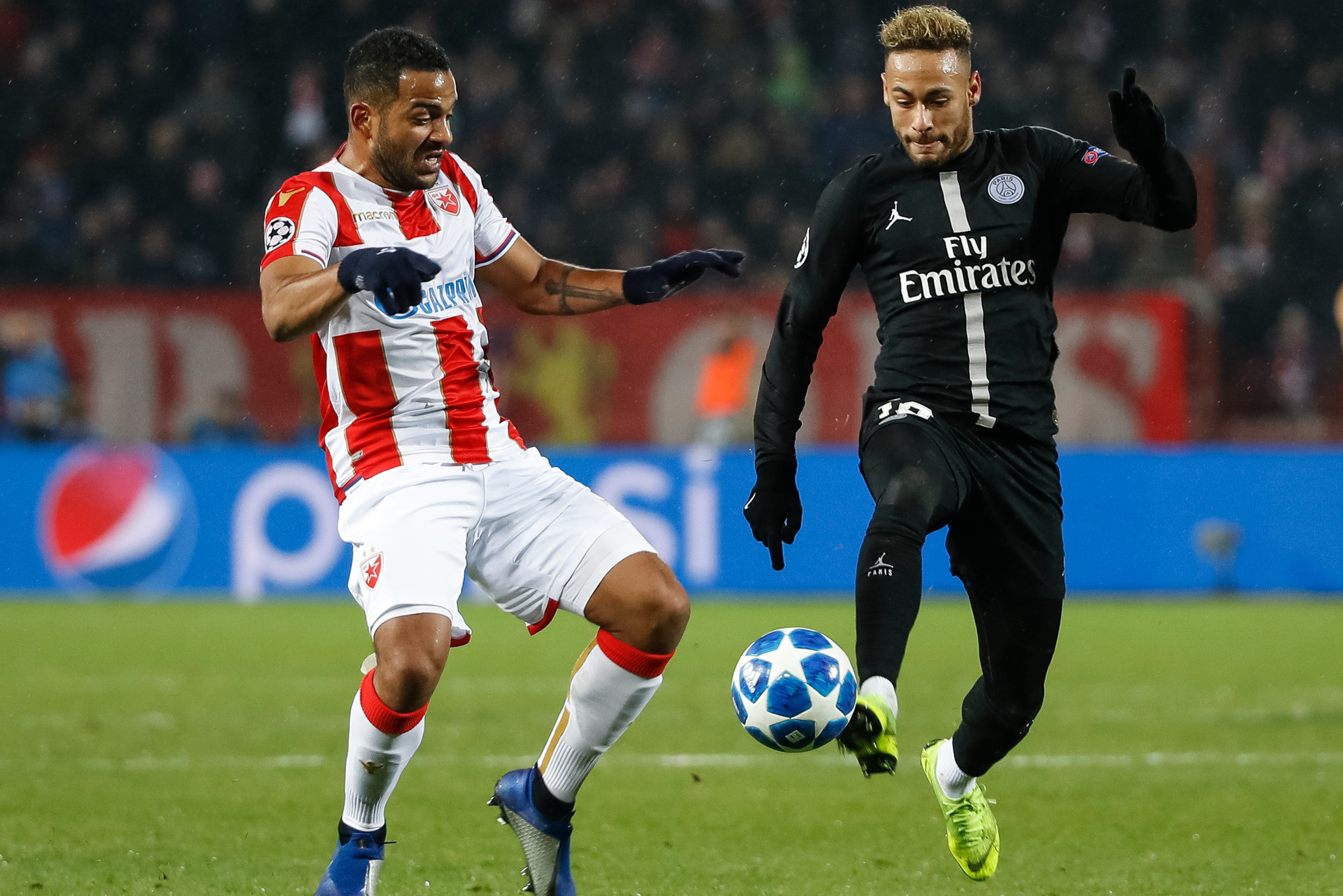 BELGRADE, SERBIA - DECEMBER 11: Neymar (R) of Paris Saint-Germain in action against Lorenzo Ebecilio (L) of Red Star Belgrade during the UEFA Champions League Group C match between Red Star Belgrade and Paris Saint-Germain at Rajko Mitic Stadium on Decemb
