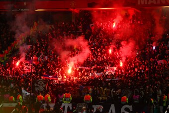 MANCHESTER, ENGLAND - FEBRUARY 12:  Paris Saint-Germain fans light flares prior to the UEFA Champions League Round of 16 First Leg match between Manchester United and Paris Saint-Germain at Old Trafford on February 12, 2019 in Manchester, England. (Photo 