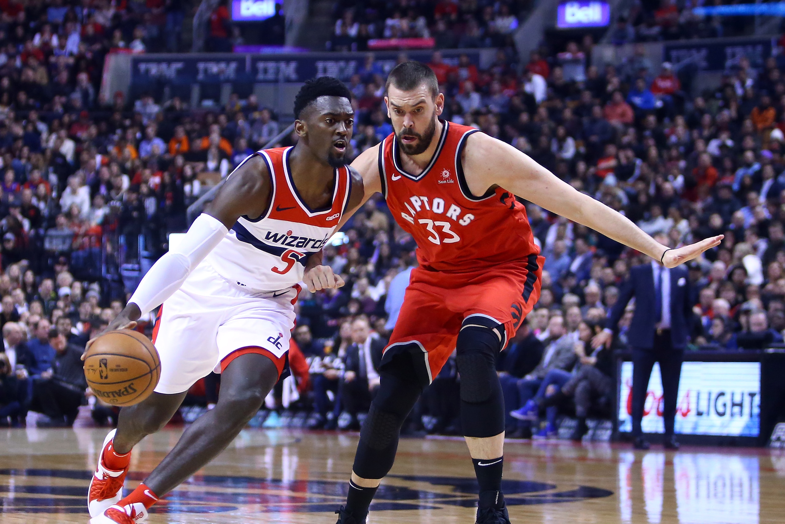 TORONTO, ON - FEBRUARY 13:  Bobby Portis #5 of the Washington Wizards dribbles the ball as Marc Gasol #33 of the Toronto Raptors defends during the first half of an NBA game at Scotiabank Arena on February 13, 2019 in Toronto, Canada.  NOTE TO USER: User 