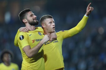 Chelsea's English midfielder Ross Barkley (R) celebrates  scoring the 0-1 goal with Chelsea's French striker Olivier Giroud during the UEFA Europa League  round of 32, first-leg football match between Malmo FF and Chelsea in Malmo, Sweden, on February 14,