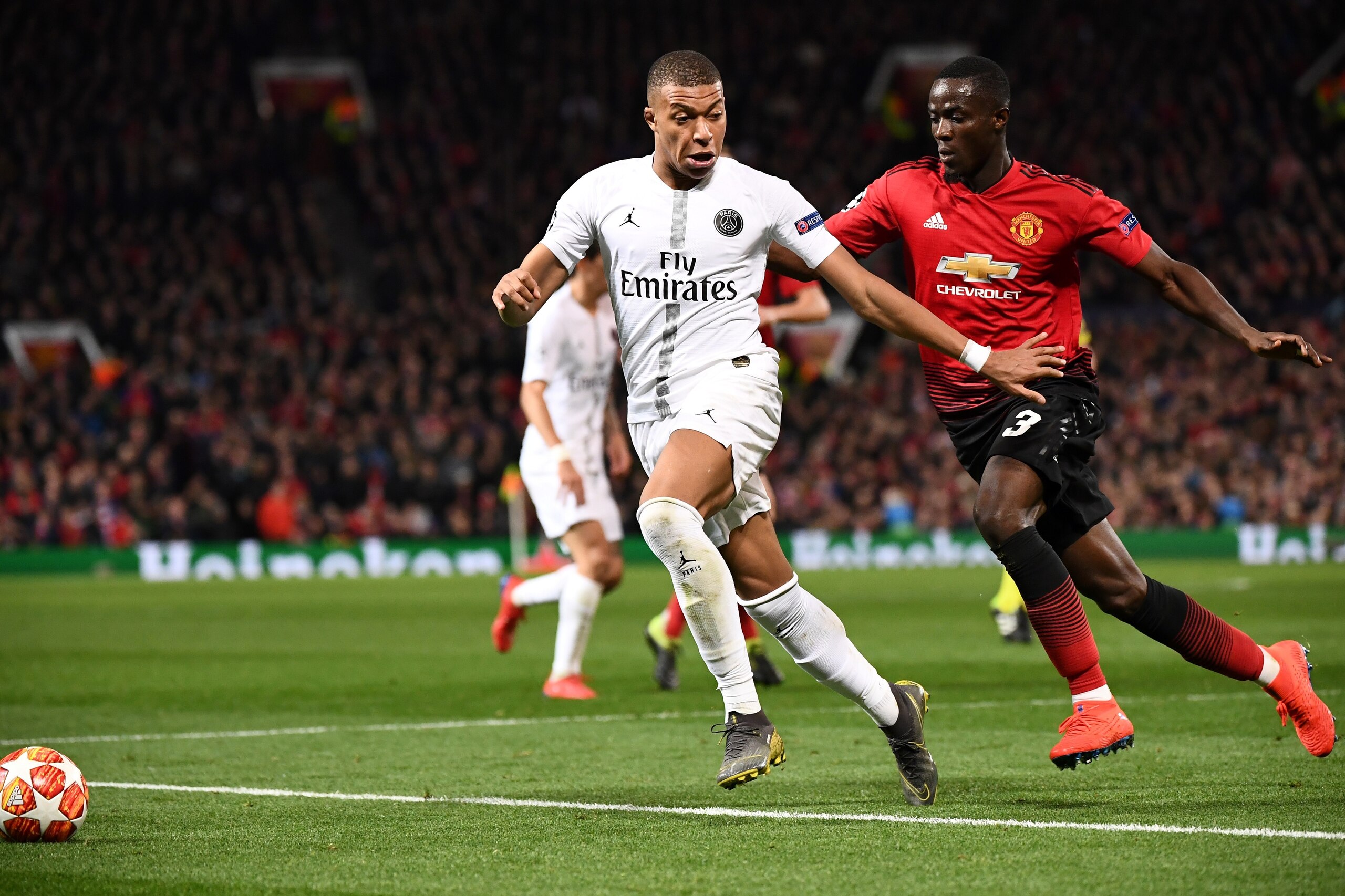 Manchester United's Ivorian defender Eric Bailly (R) vies with Paris Saint-Germain's French striker Kylian Mbappe during the first leg of the UEFA Champions League round of 16 football match between Manchester United and Paris Saint-Germain (PSG) at Old T