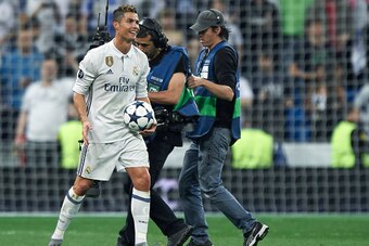 MADRID, SPAIN - MAY 02:  Cristiano Ronaldo of Real Madrid with the match ball after scoring a hattrick during the UEFA Champions League Semi Final first leg match between Real Madrid CF and Club Atletico de Madrid at Estadio Santiago Bernabeu on May 2, 20