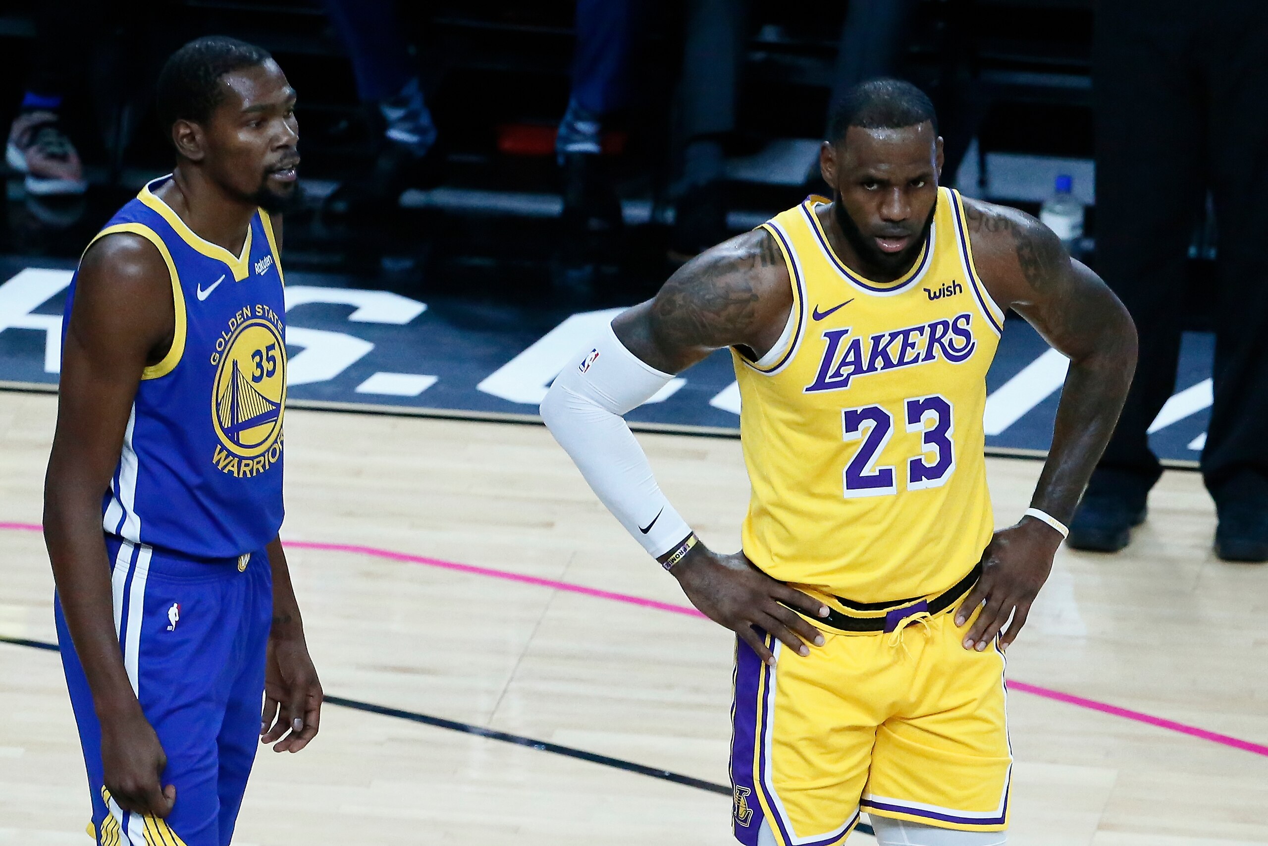 LAS VEGAS, NV- OCTOBER 10: LeBron James #23 of the Los Angeles Lakers and Kevin Durant #35 of the Golden State Warriors look on during the game on October 10, 2018 at T-Mobile Arena in Las Vegas, Nevada. NOTE TO USER: User expressly acknowledges and agr LAS VEGAS, NV- OCTOBER 10: LeBron James #23 of the Los Angeles Lakers and Kevin Durant #35 of the Golden State Warriors look on during the game on October 10, 2018 at T-Mobile Arena in Las Vegas, Nevada. NOTE TO USER: User expressly acknowledges and agr