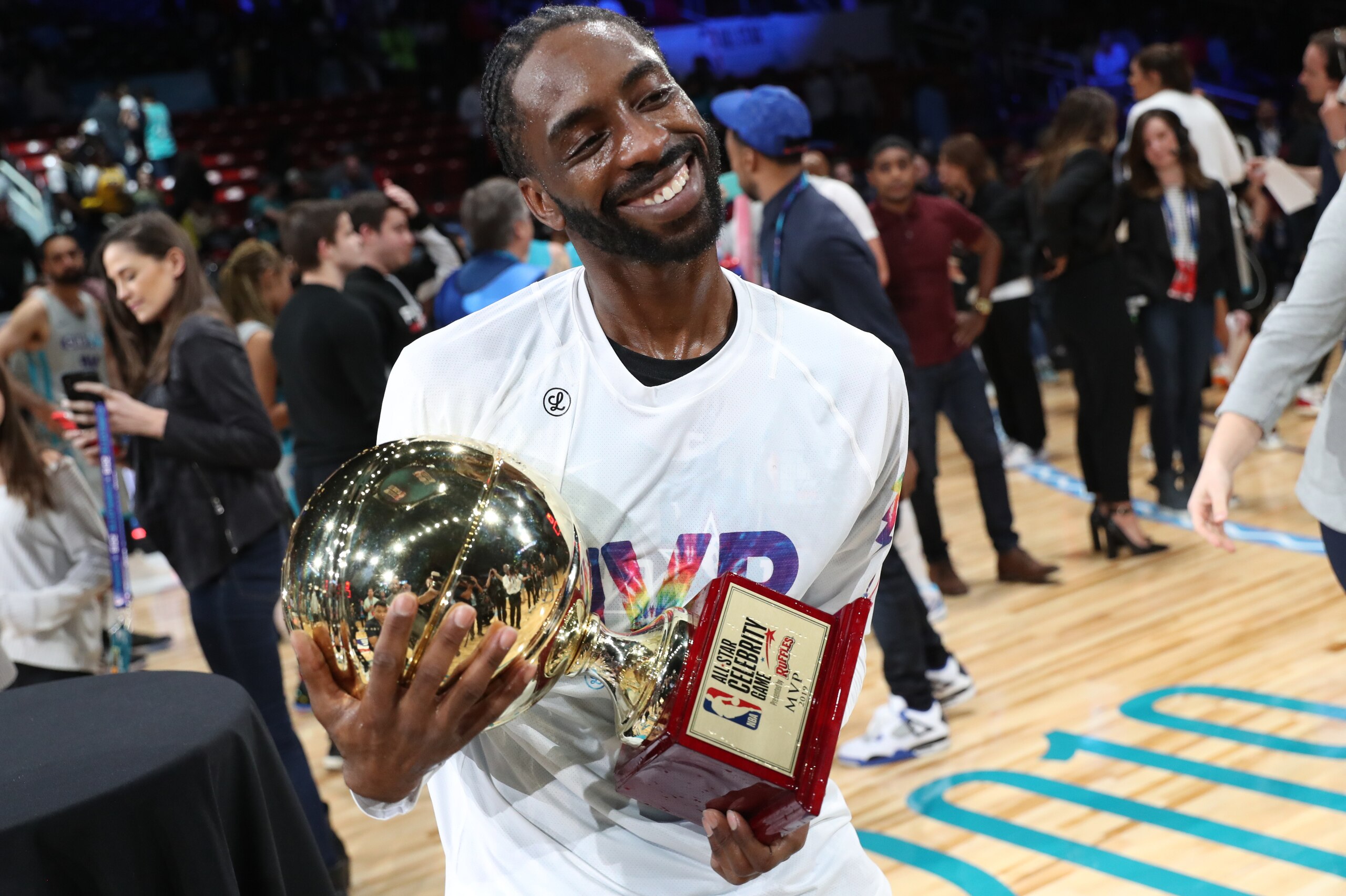 CHARLOTTE, NC - FEBRUARY 15: Famous Los #32 holds the MVP trophy after the 2019 NBA All-Star Celebrity Game on February 15, 2019 at Bojangles Coliseum in Charlotte, North Carolina. NOTE TO USER: User expressly acknowledges and agrees that, by downloading 
