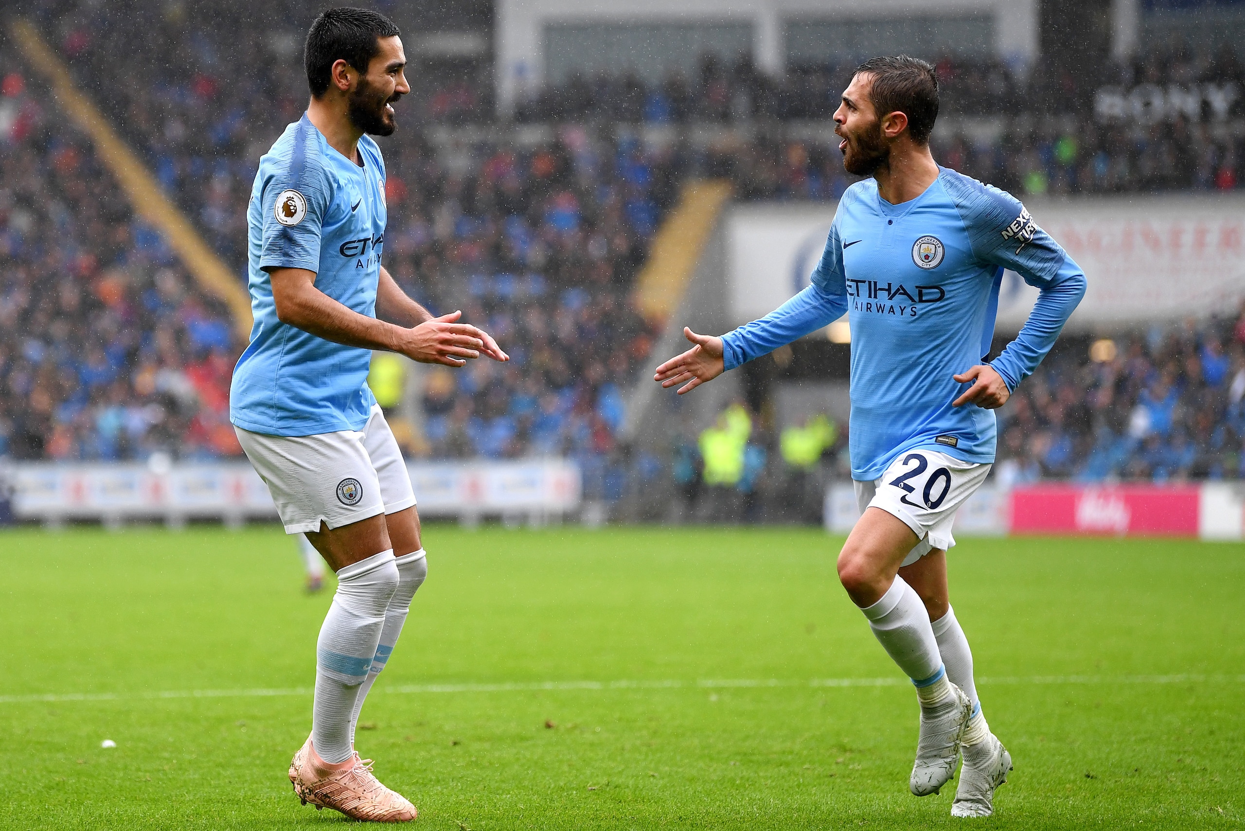 CARDIFF, WALES - SEPTEMBER 22: Bernardo Silva of Manchester City celebrates with teammate Ilkay Gundogan after scoring his team's second goal during the Premier League match between Cardiff City and Manchester City at Cardiff City Stadium on September 22 CARDIFF, WALES - SEPTEMBER 22: Bernardo Silva of Manchester City celebrates with teammate Ilkay Gundogan after scoring his team's second goal during the Premier League match between Cardiff City and Manchester City at Cardiff City Stadium on September 22