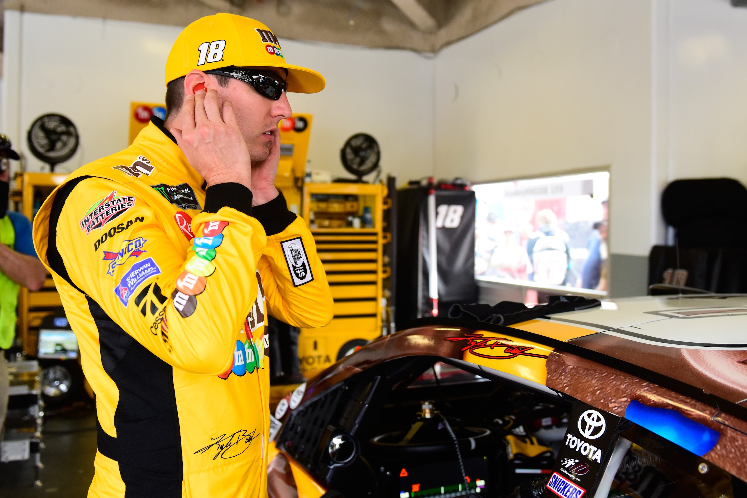 DAYTONA BEACH, FL - FEBRUARY 15:  Kyle Busch, driver of the #18 M&M's Chocolate Bar Toyota, prepares to drive during practice for the Monster Energy NASCAR Cup Series 61st Annual Daytona 500  at Daytona International Speedway on February 15, 2019 in Dayto