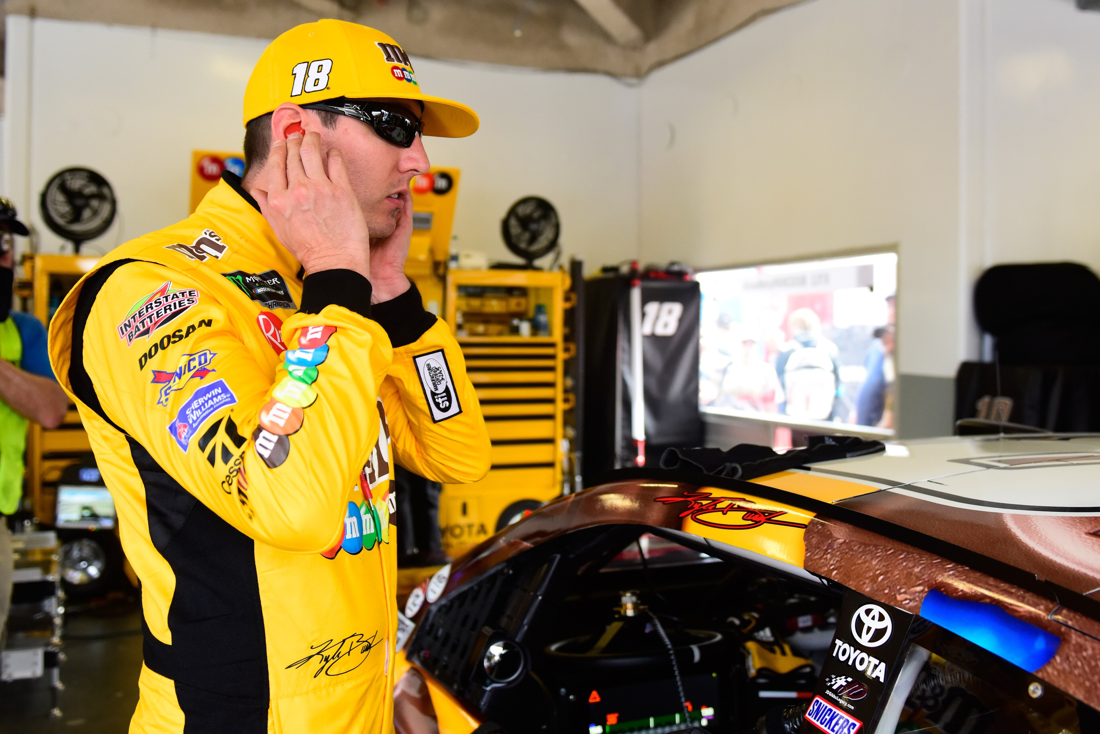 DAYTONA BEACH, FL - FEBRUARY 15:  Kyle Busch, driver of the #18 M&M's Chocolate Bar Toyota, prepares to drive during practice for the Monster Energy NASCAR Cup Series 61st Annual Daytona 500  at Daytona International Speedway on February 15, 2019 in Dayto