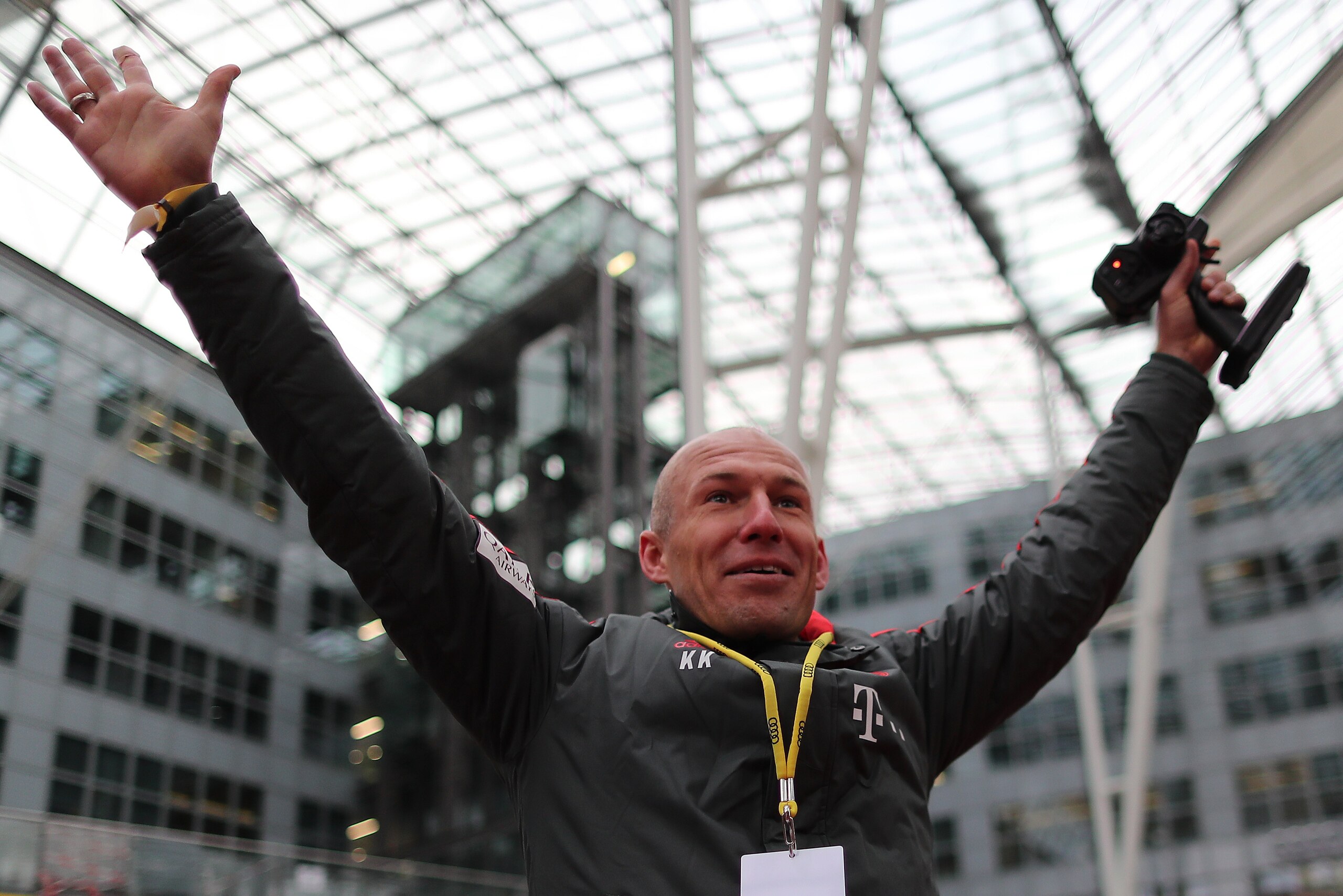 MUNICH, GERMANY - JANUARY 24: Arjen Robben of Bayern Muenchen raises his arms in celebration during a promotional event at Airport Munich on January 24, 2019 in Munich, Germany. FC Bayern meets Audi e-tron: FC Bayern was one of the first Audi partners to 