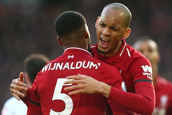 LIVERPOOL, ENGLAND - FEBRUARY 09:  Georginio Wijnaldum of Liverpool celebrates after scoring his team's second goal with teammate Fabinho during the Premier League match between Liverpool FC and AFC Bournemouth at Anfield on February 9, 2019 in Liverpool,