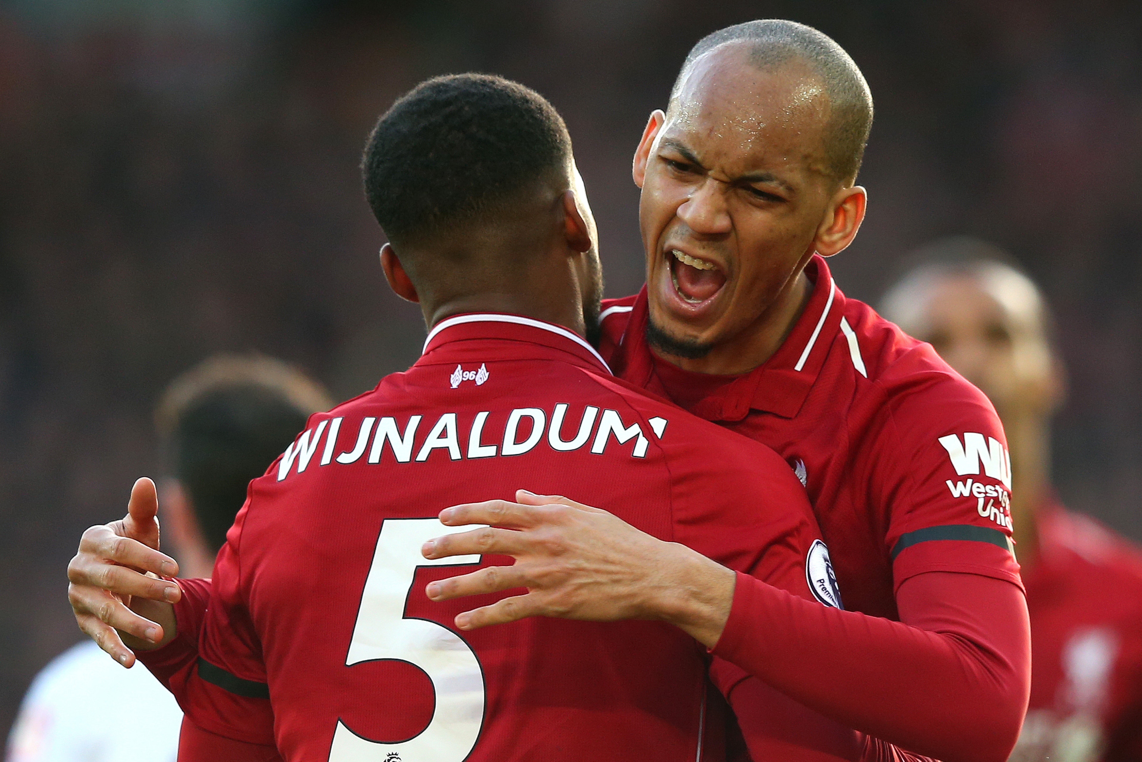 LIVERPOOL, ENGLAND - FEBRUARY 09:  Georginio Wijnaldum of Liverpool celebrates after scoring his team's second goal with teammate Fabinho during the Premier League match between Liverpool FC and AFC Bournemouth at Anfield on February 9, 2019 in Liverpool,