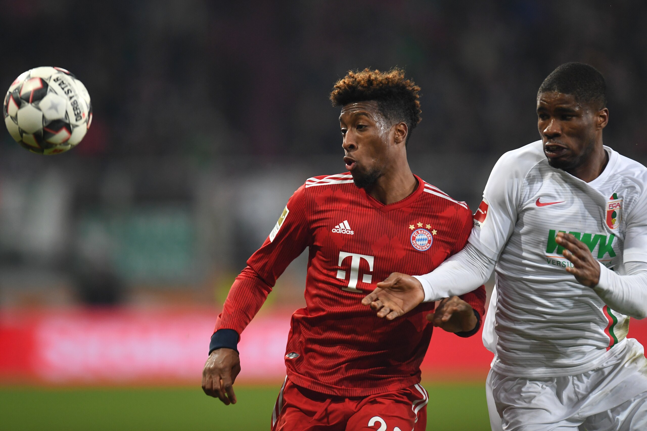 Bayern Munich's French defender Kingsley Coman (L) and Augsburg's Austrian defender Kevin Danso vie for the ball during the German first division Bundesliga match between FC Augsburg and FC Bayern Munich in Augsburg, southern Germany, on February 15, 2019 Bayern Munich's French defender Kingsley Coman (L) and Augsburg's Austrian defender Kevin Danso vie for the ball during the German first division Bundesliga match between FC Augsburg and FC Bayern Munich in Augsburg, southern Germany, on February 15, 2019