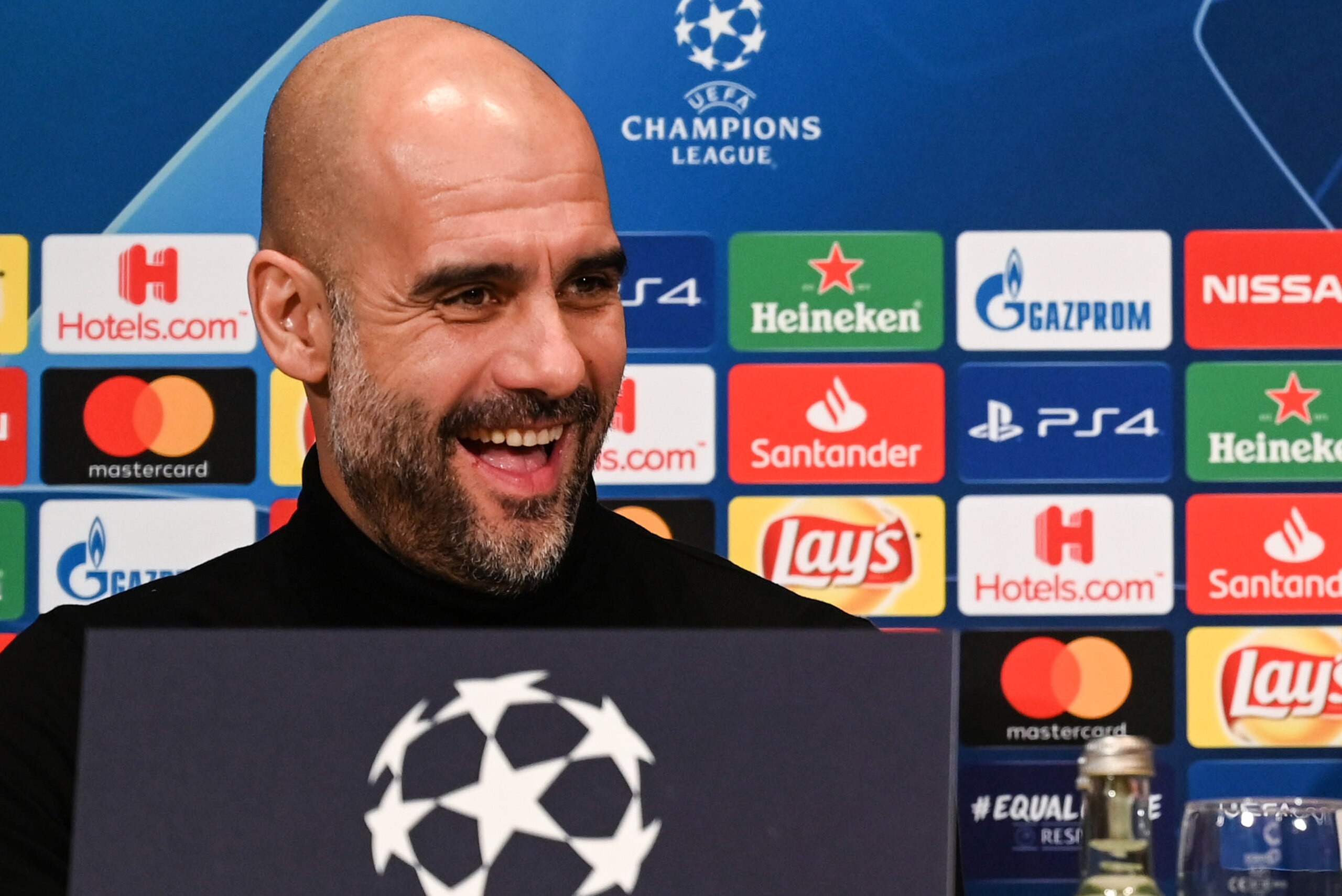 Manchester City's Spanish manager Pep Guardiola attends a press conference on February 19, 2019 in Essen, western Germany, on the eve of the UEFA Champions League, last 16, first leg football match of FC Schalke 04 vs Manchester City. (Photo by Patrik STO