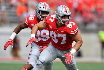 COLUMBUS, OH - SEPTEMBER 1:  Malik Harrison #39 of the Ohio State Buckeyes and Nick Bosa #97 of the Ohio State Buckeyes defend against the Oregon State Beavers at Ohio Stadium on September 1, 2018 in Columbus, Ohio. Ohio State defeated Oregon State 77-31.