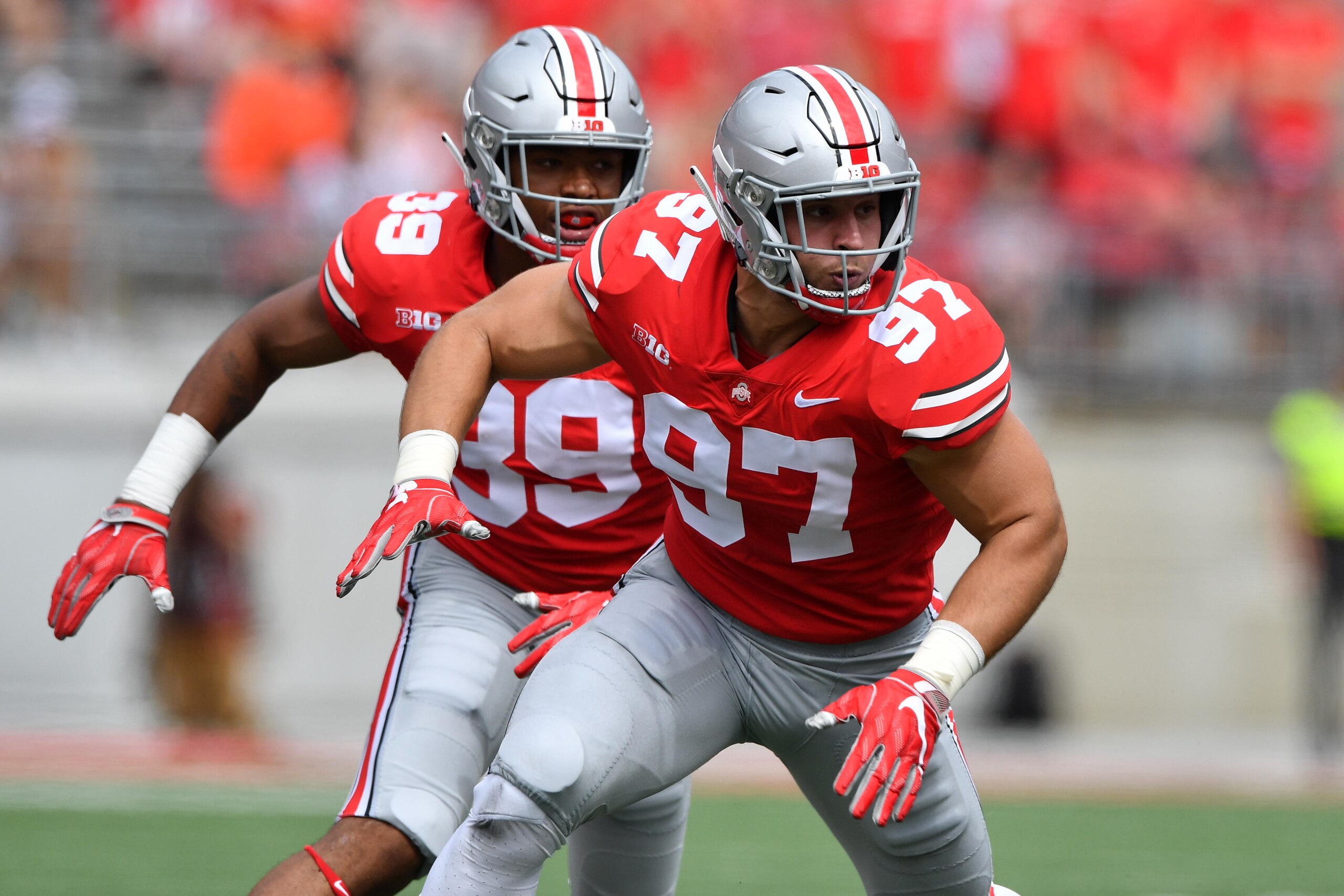 COLUMBUS, OH - SEPTEMBER 1:  Malik Harrison #39 of the Ohio State Buckeyes and Nick Bosa #97 of the Ohio State Buckeyes defend against the Oregon State Beavers at Ohio Stadium on September 1, 2018 in Columbus, Ohio. Ohio State defeated Oregon State 77-31.