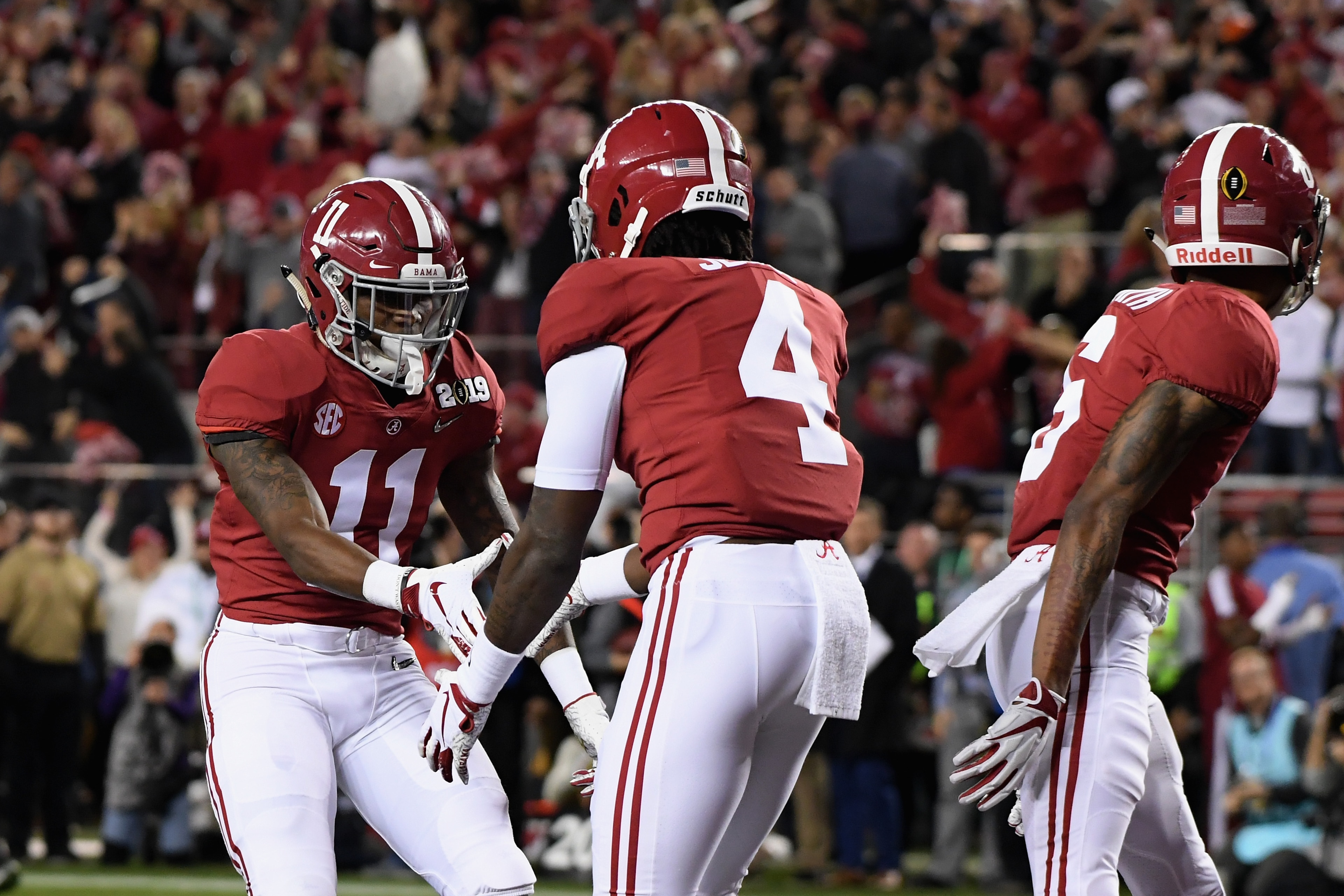 SANTA CLARA, CA - JANUARY 07: Jerry Jeudy #4 of the Alabama Crimson Tide is congratulated by his teammate Henry Ruggs III #11 after scoring a first quarter touchdown reception against the Clemson Tigersin the CFP National Championship presented by AT&T a SANTA CLARA, CA - JANUARY 07: Jerry Jeudy #4 of the Alabama Crimson Tide is congratulated by his teammate Henry Ruggs III #11 after scoring a first quarter touchdown reception against the Clemson Tigersin the CFP National Championship presented by AT&T a