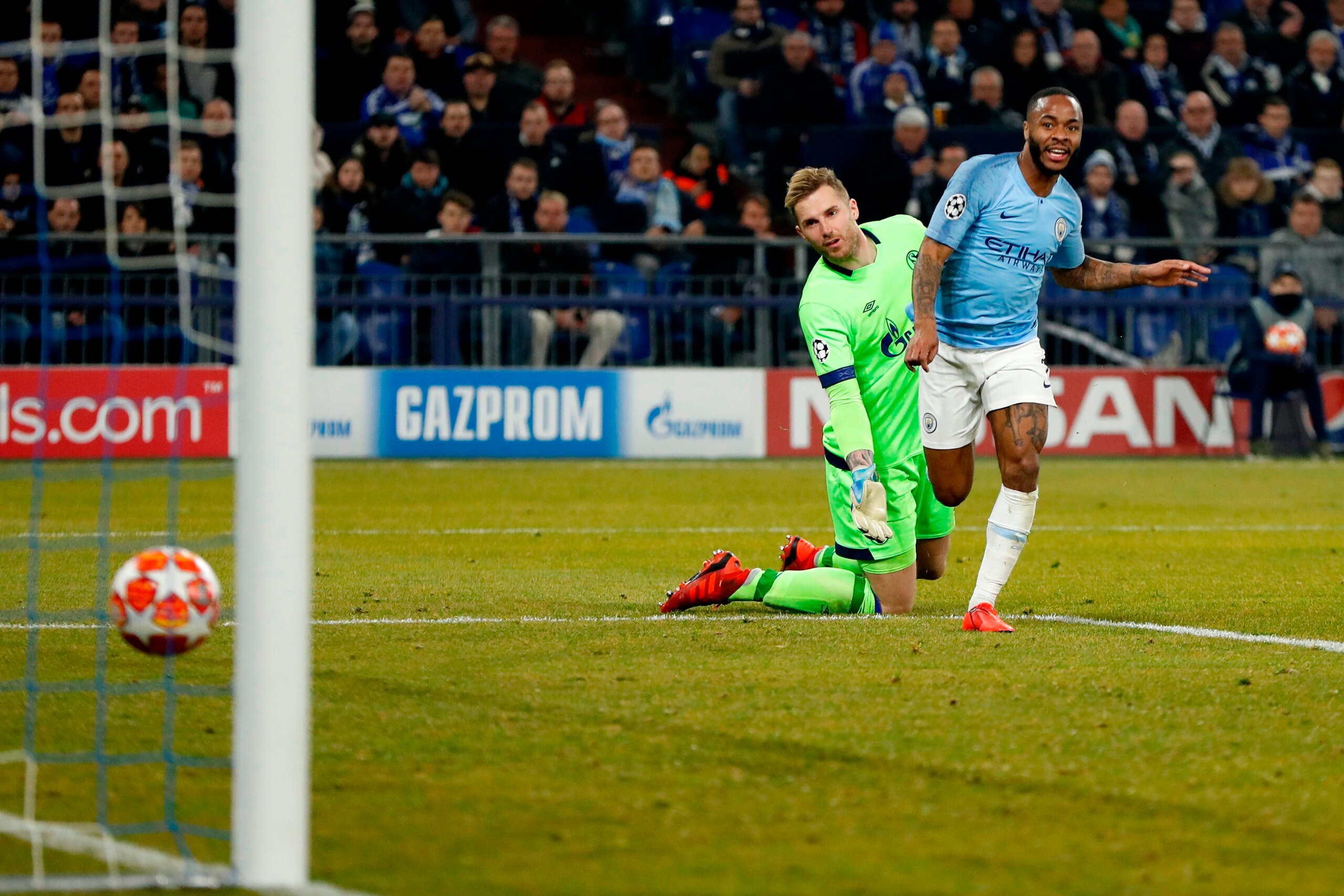 Manchester City's English forward Raheem Sterling scores the winning 2-3 goal in front of Schalke's German goalkeeper Ralf Faehrmann during the UEFA Champions League round of 16 first leg football match between Schalke 04 and Manchester City on February Manchester City's English forward Raheem Sterling scores the winning 2-3 goal in front of Schalke's German goalkeeper Ralf Faehrmann during the UEFA Champions League round of 16 first leg football match between Schalke 04 and Manchester City on February