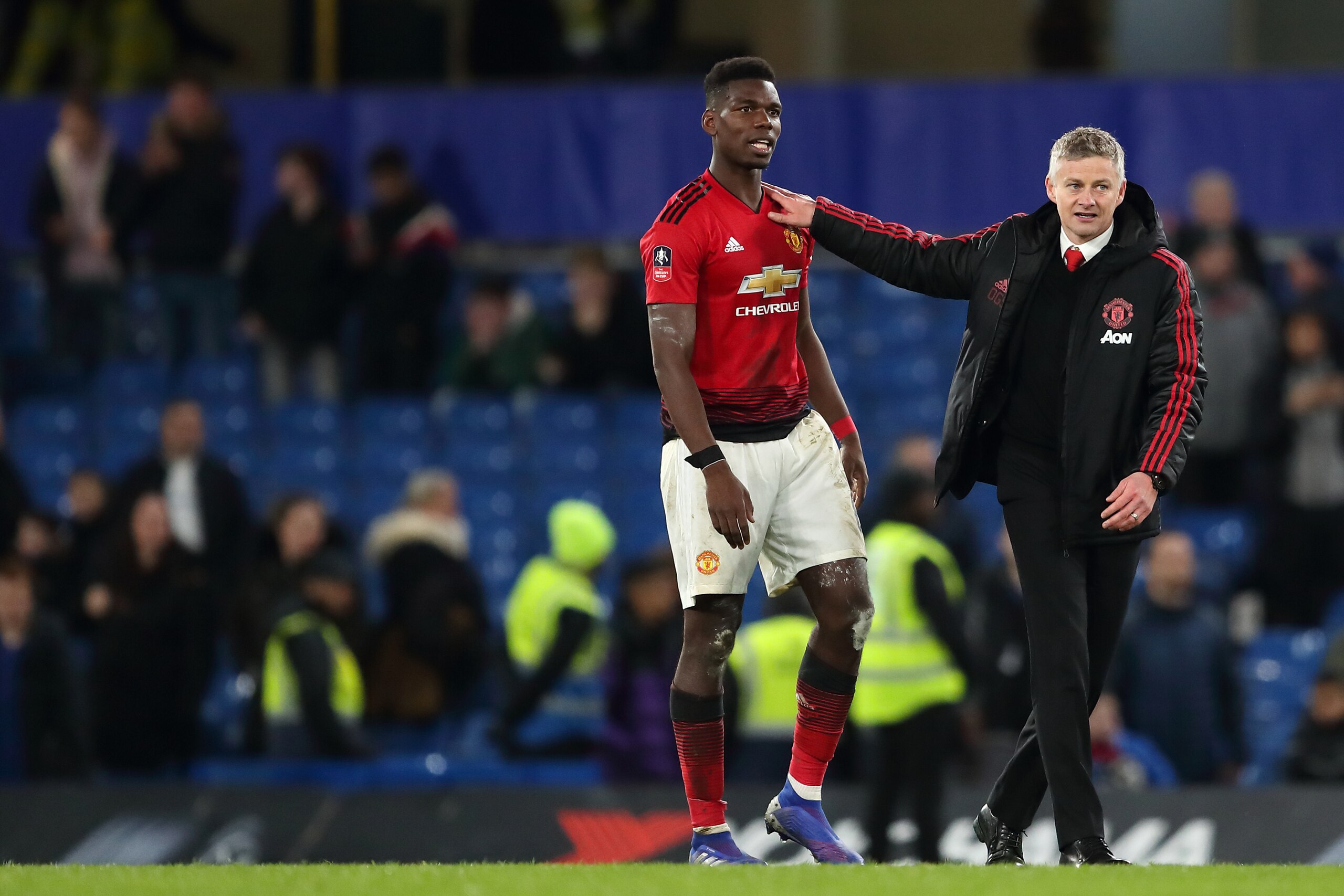 LONDON, ENGLAND - FEBRUARY 18: Paul Pogba of Manchester United and Manchester United Caretaker manager Ole Gunnar Solskjaer at full time of the FA Cup Fifth Round match between Chelsea and Manchester United at Stamford Bridge on February 18, 2019 in Londo