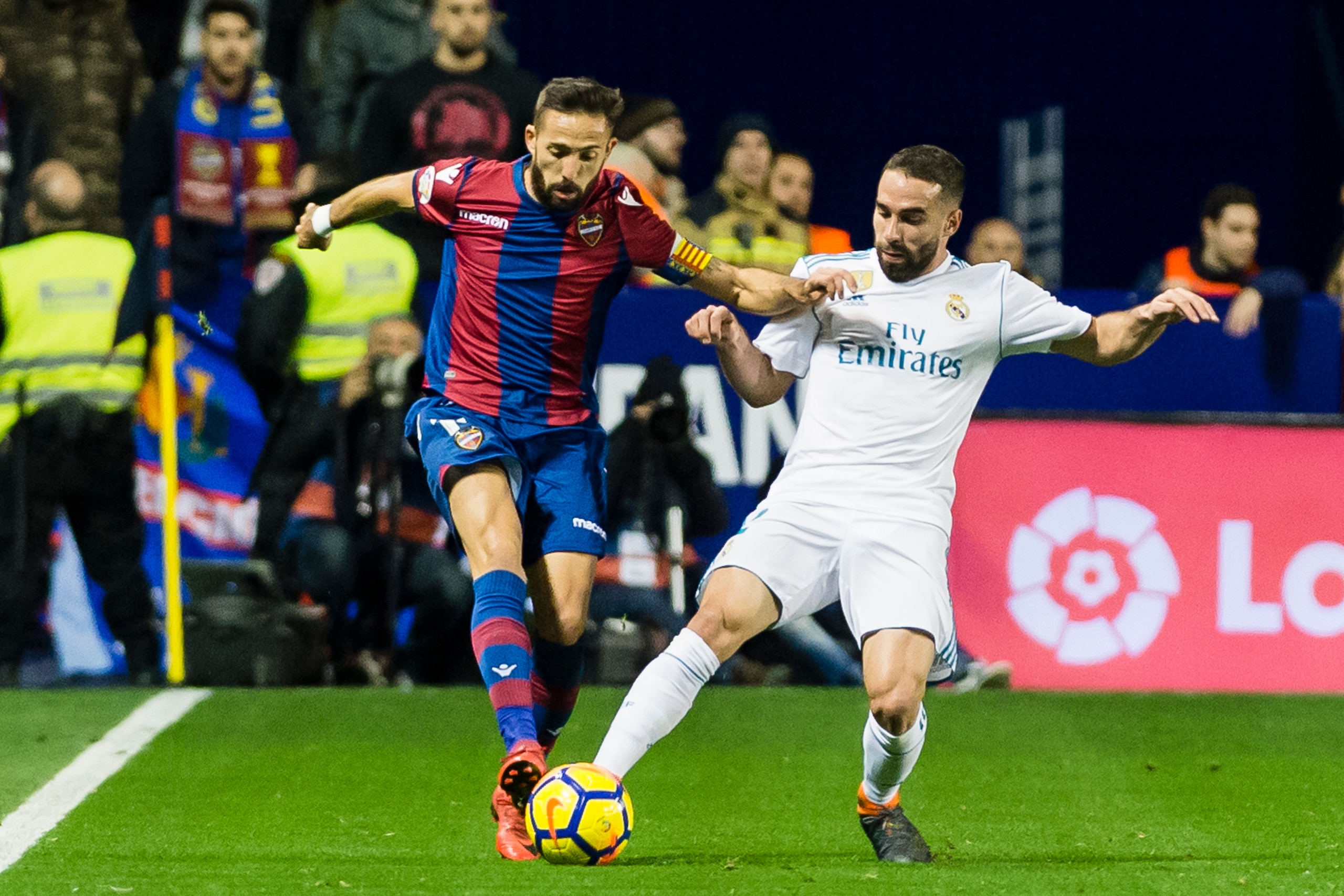 VALENCIA, SPAIN - FEBRUARY 03: Daniel Carvajal Ramos of Real Madrid (R) fights for the ball with Jose Luis Morales Nogales of Levante UD (L)  during the La Liga 2017-18 match between Levante UD and Real Madrid at Estadio Ciutat de Valencia on 03 February 