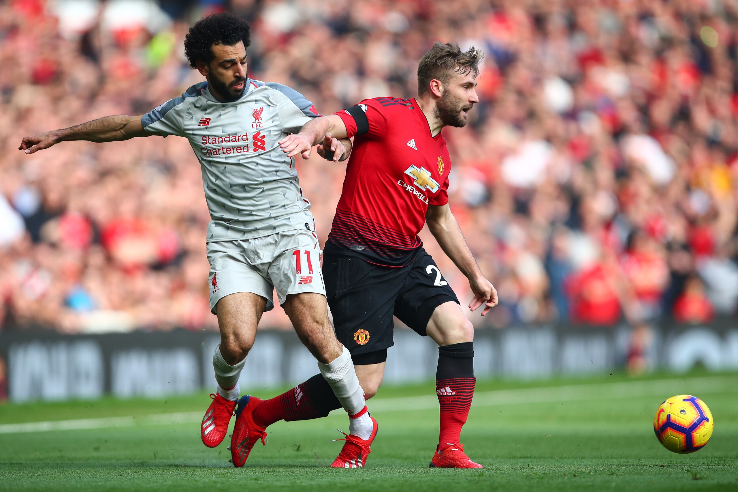 MANCHESTER, ENGLAND - FEBRUARY 24: Mohamed Salah of Liverpool and Luke Shaw of Manchester United during the Premier League match between Manchester United and Liverpool FC at Old Trafford on February 24, 2019 in Manchester, United Kingdom. (Photo by Robbi MANCHESTER, ENGLAND - FEBRUARY 24: Mohamed Salah of Liverpool and Luke Shaw of Manchester United during the Premier League match between Manchester United and Liverpool FC at Old Trafford on February 24, 2019 in Manchester, United Kingdom. (Photo by Robbi