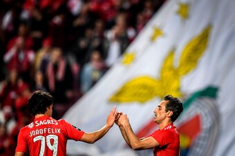 Benfica's Brazilian forward Jonas Oliveira celebrates with Benfica's Portuguese midfielder Joao Felix (L) after scoring a goal during the Portuguese League football match between SL Benfica and Chaves at the Luz stadium on February 25, 2019. (Photo by PAT