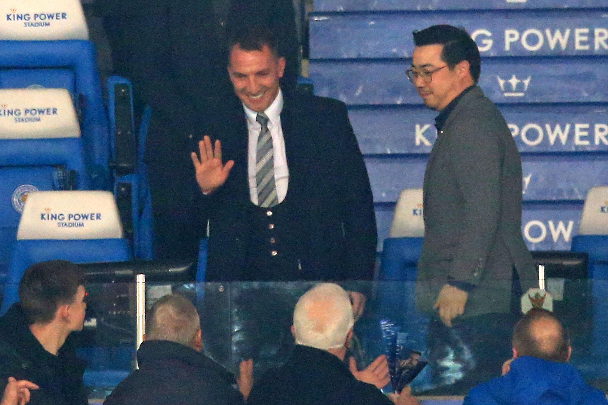 Appointed earlier in the evening, Leicester City's Northern Irish manager Brendan Rodgers (C) is welcomed by supporters ahead of the English Premier League football match between Leicester City and Brighton and Hove Albion at King Power Stadium in Leicest