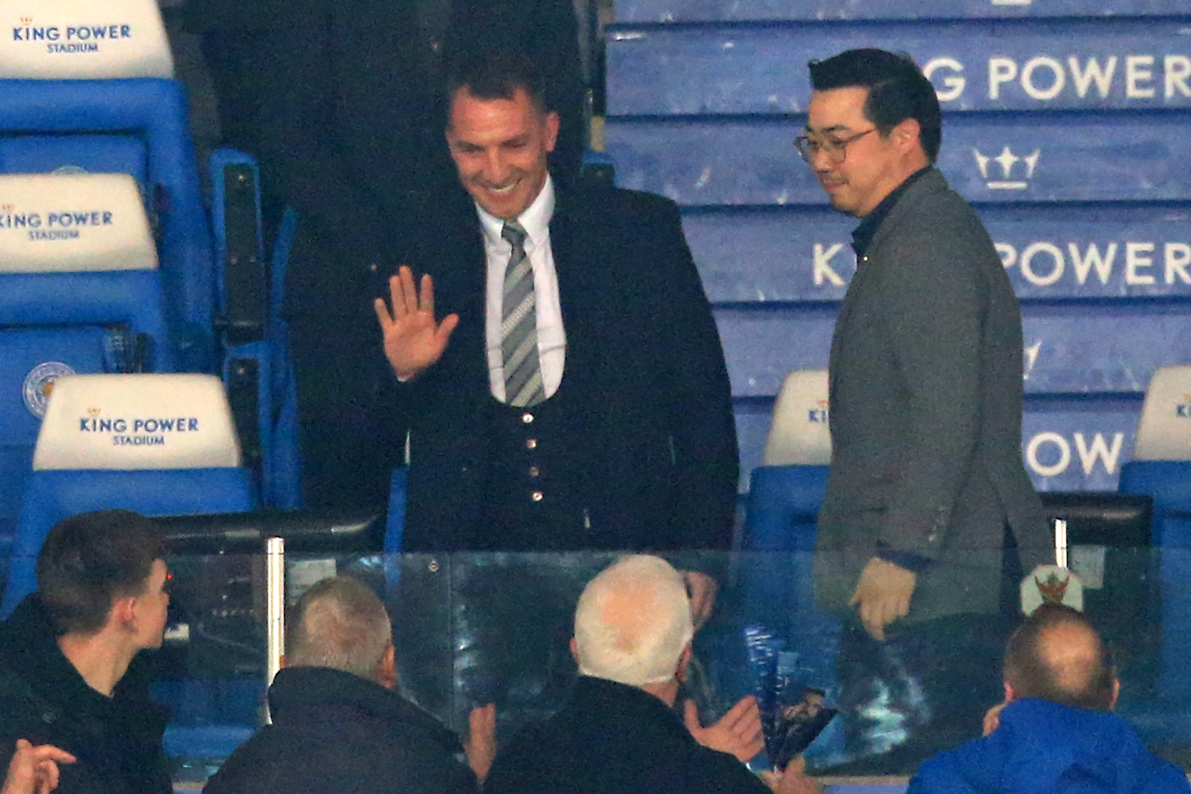 Appointed earlier in the evening, Leicester City's Northern Irish manager Brendan Rodgers (C) is welcomed by supporters ahead of the English Premier League football match between Leicester City and Brighton and Hove Albion at King Power Stadium in Leicest