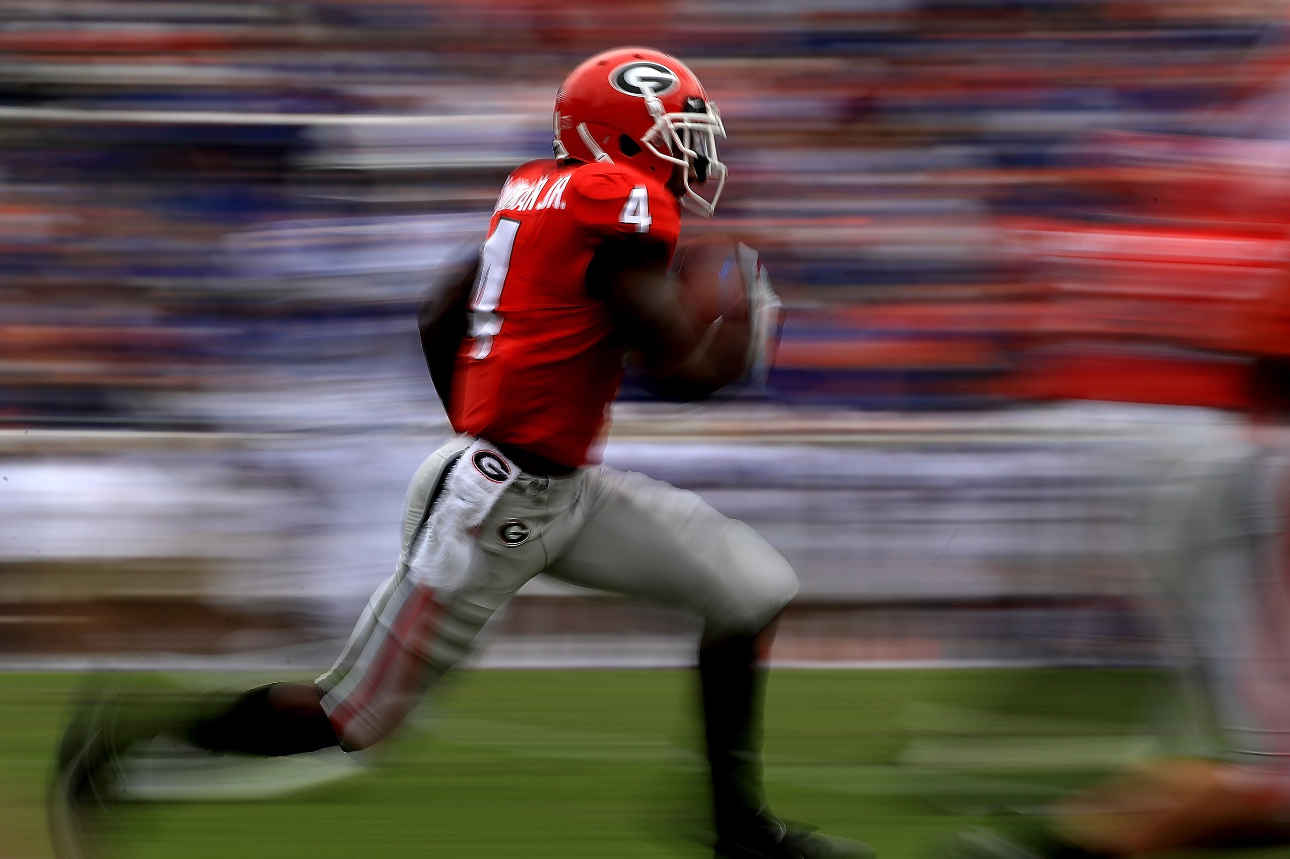 JACKSONVILLE, FL - OCTOBER 27: Mecole Hardman #4 of the Georgia Bulldogs returns a kick during a game against the Florida Gators at TIAA Bank Field on October 27, 2018 in Jacksonville, Florida.  (Photo by Mike Ehrmann/Getty Images)