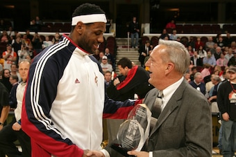 CLEVELAND - JANUARY 19:  LeBron James #23 of the Cleveland Cavaliers accepts the Eastern Conference Player of the Month Award for December 2009 from Kia Motors representative Steve Widzinski during half time of the game against the Toronto Raptors on Janu