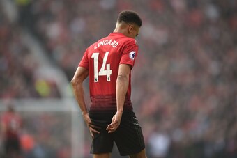 Manchester United's English midfielder Jesse Lingard touches the ball of his leg during the English Premier League football match between Manchester United and Liverpool at Old Trafford in Manchester, north west England, on February 24, 2019. (Photo by Ol
