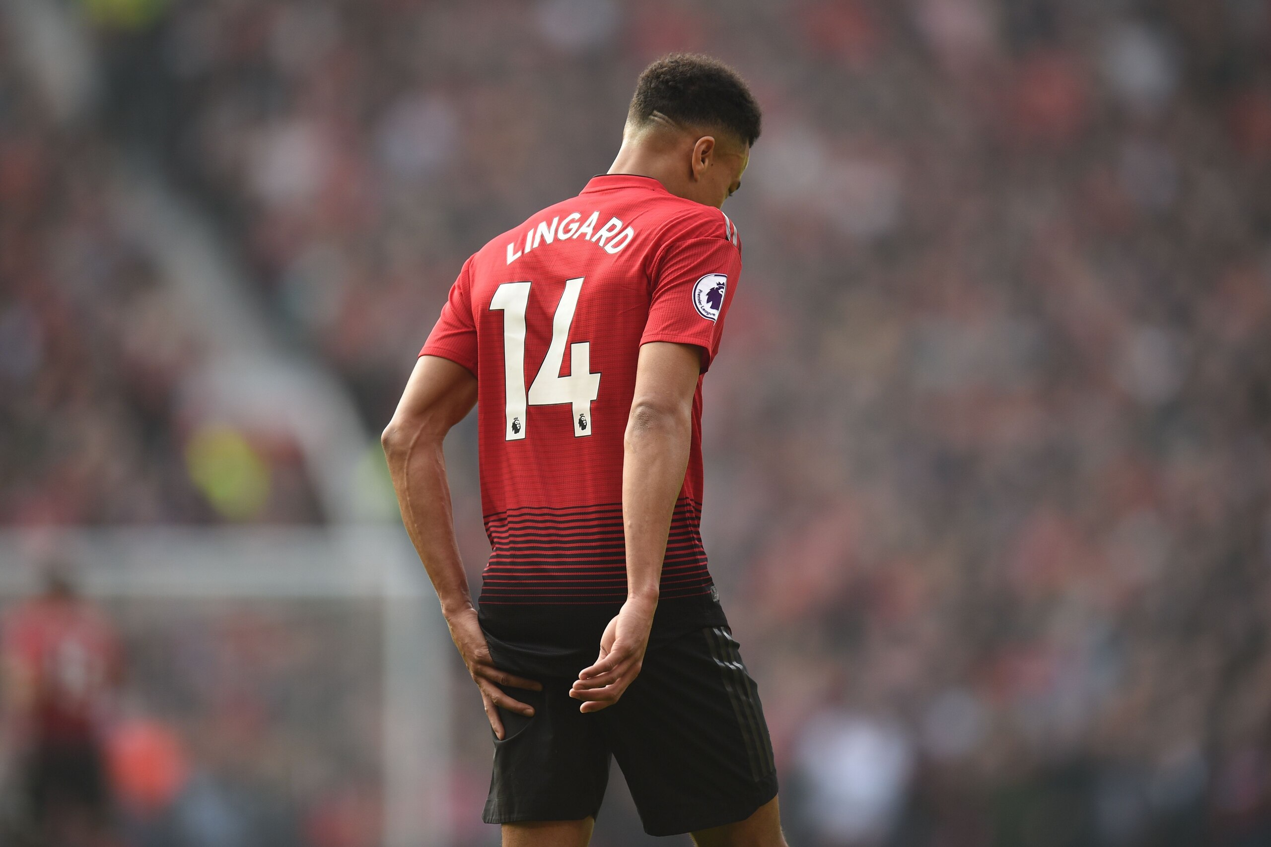 Manchester United's English midfielder Jesse Lingard touches the ball of his leg during the English Premier League football match between Manchester United and Liverpool at Old Trafford in Manchester, north west England, on February 24, 2019. (Photo by Ol