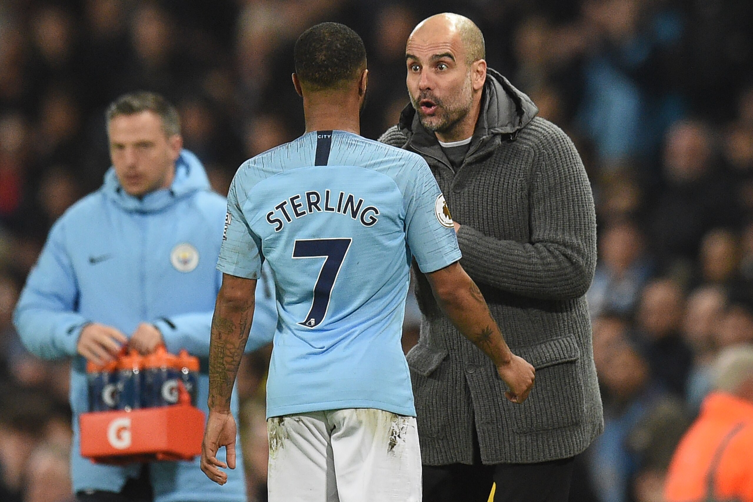 Manchester City's Spanish manager Pep Guardiola (R) talks to Manchester City's English midfielder Raheem Sterling during the English Premier League football match between Manchester City and West Ham United at the Etihad Stadium in Manchester, north west Manchester City's Spanish manager Pep Guardiola (R) talks to Manchester City's English midfielder Raheem Sterling during the English Premier League football match between Manchester City and West Ham United at the Etihad Stadium in Manchester, north west