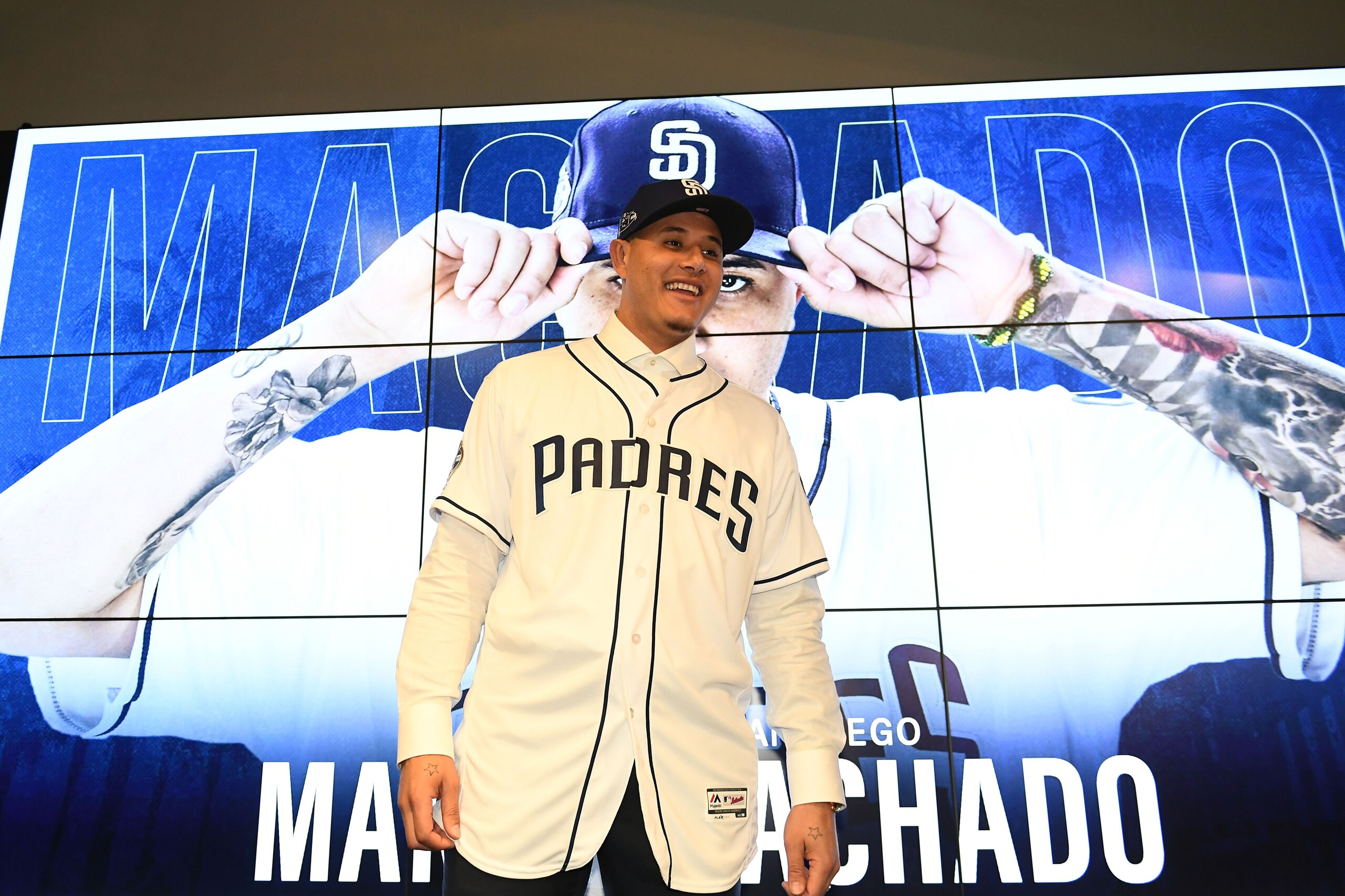 PEORIA, ARIZONA - FEBRUARY 22: Manny Machado #8 of the San Diego Padres smiles during a press conference at Peoria Stadium on February 22, 2019 in Peoria, Arizona. (Photo by Jennifer Stewart/Getty Images) PEORIA, ARIZONA - FEBRUARY 22: Manny Machado #8 of the San Diego Padres smiles during a press conference at Peoria Stadium on February 22, 2019 in Peoria, Arizona. (Photo by Jennifer Stewart/Getty Images)
