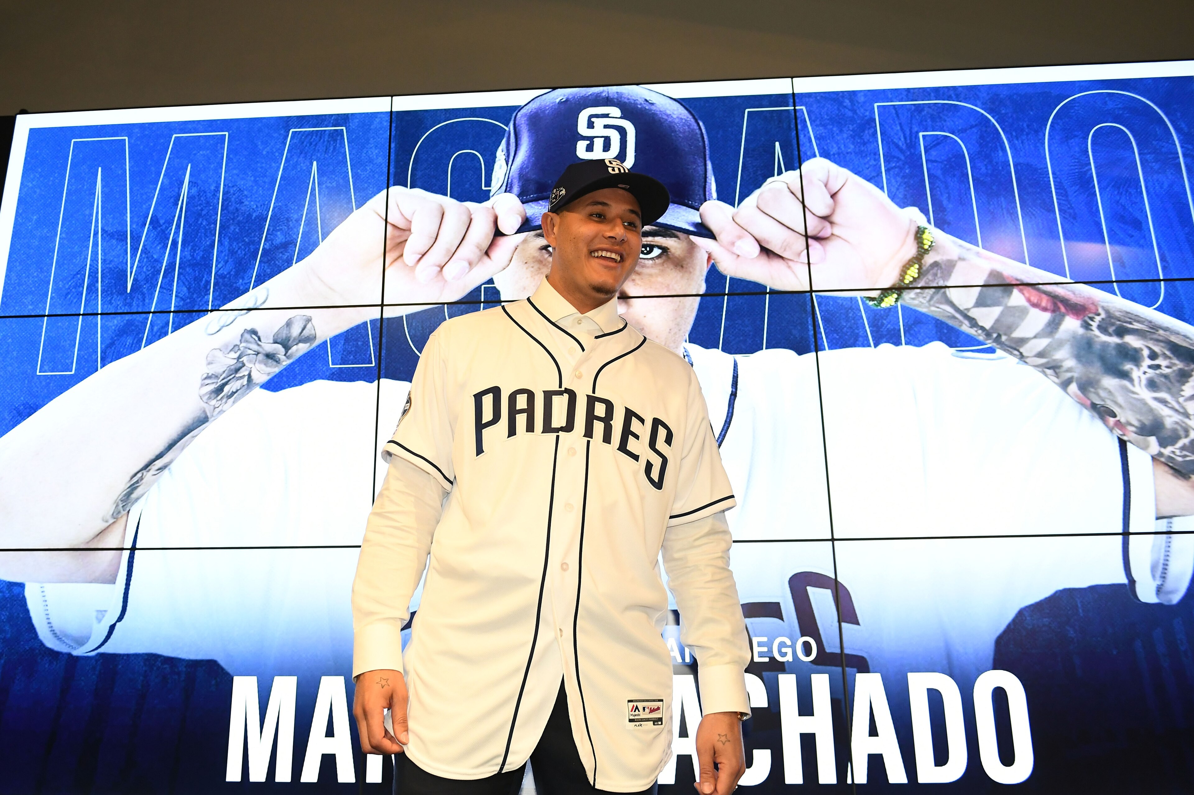 PEORIA, ARIZONA - FEBRUARY 22: Manny Machado #8 of the San Diego Padres smiles during a press conference at Peoria Stadium on February 22, 2019 in Peoria, Arizona. (Photo by Jennifer Stewart/Getty Images) PEORIA, ARIZONA - FEBRUARY 22: Manny Machado #8 of the San Diego Padres smiles during a press conference at Peoria Stadium on February 22, 2019 in Peoria, Arizona. (Photo by Jennifer Stewart/Getty Images)