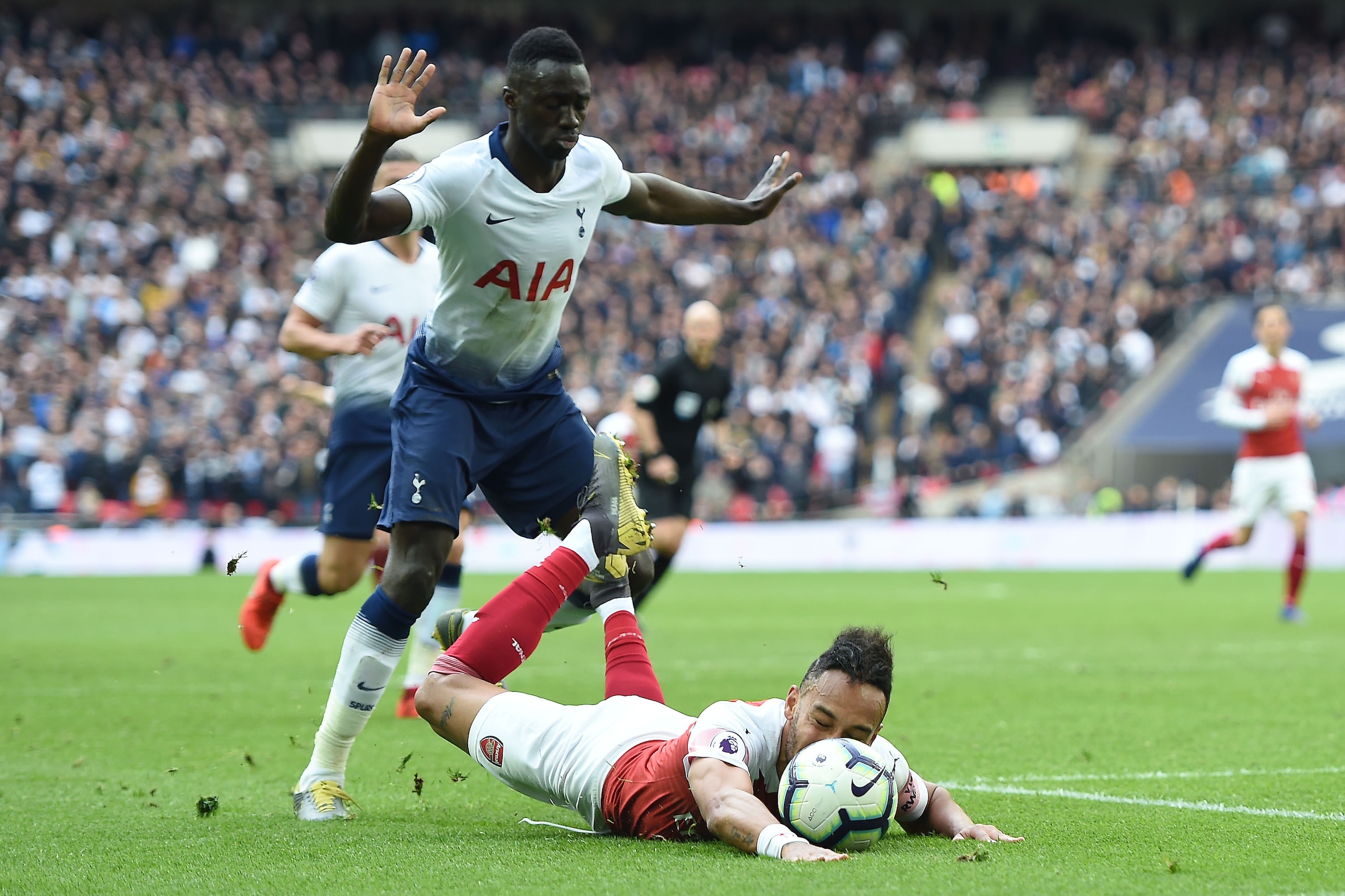LONDON, ENGLAND - MARCH 02: Pierre-Emerick Aubameyang of Arsenal is fouled by Davinson Sanzhez of Tottenham Hotspur leading to a penalty being awarded to Arsenal during the Premier League match between Tottenham Hotspur and Arsenal FC at Wembley Stadium o