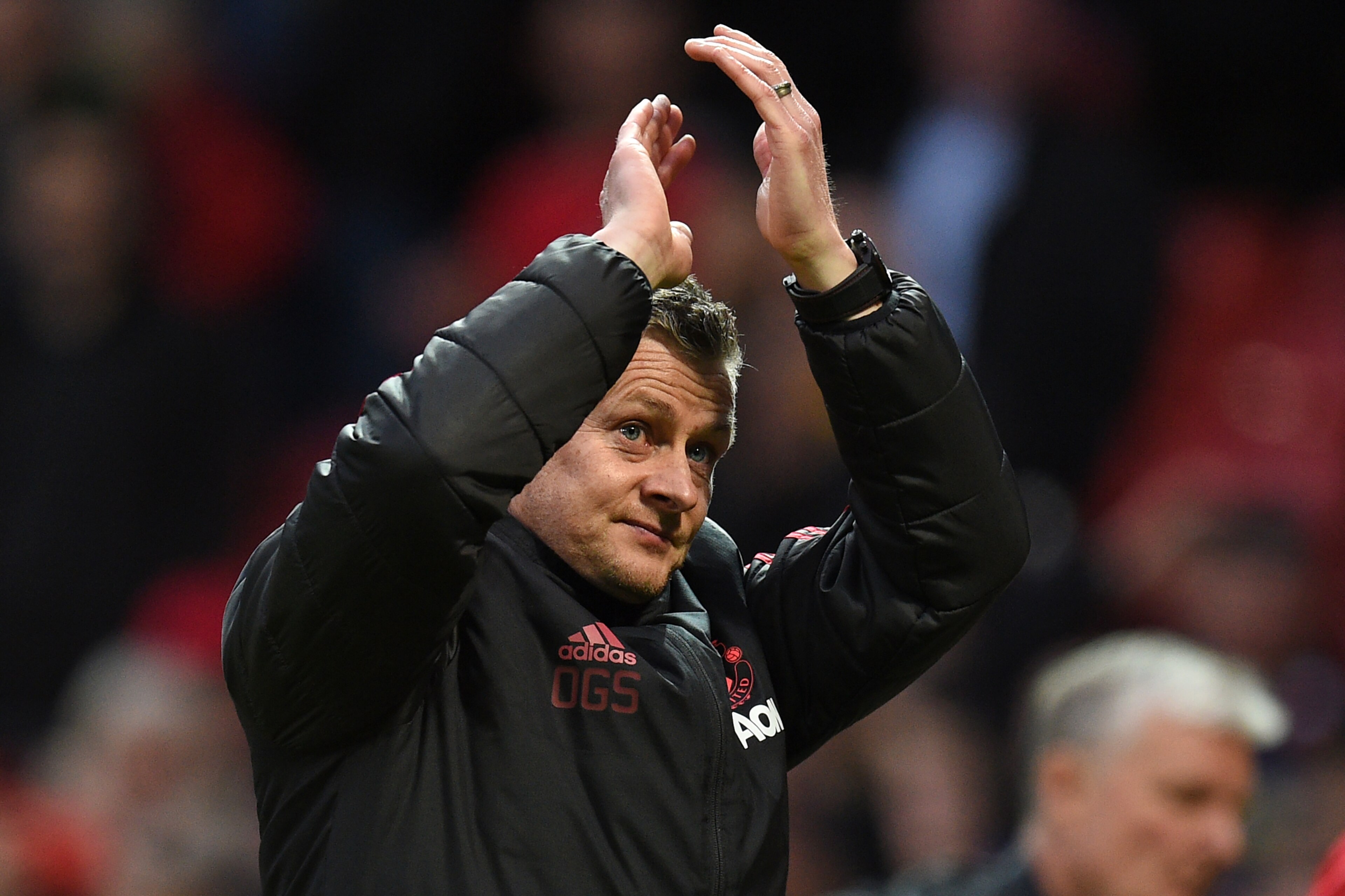 Manchester United's  Norwegian caretaker manager Ole Gunnar Solskjaer applauds supporters on the pitch after the English Premier League football match between Manchester United and Southampton at Old Trafford in Manchester, north west England, on March 2,