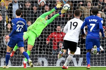 Chelsea's Spanish goalkeeper Kepa Arrizabalaga makes a late save during the English Premier League football match between Fulham and Chelsea at Craven Cottage in London on March 3, 2019. - Chelsea won the game 2-1. (Photo by Glyn KIRK / AFP) / RESTRICTED 
