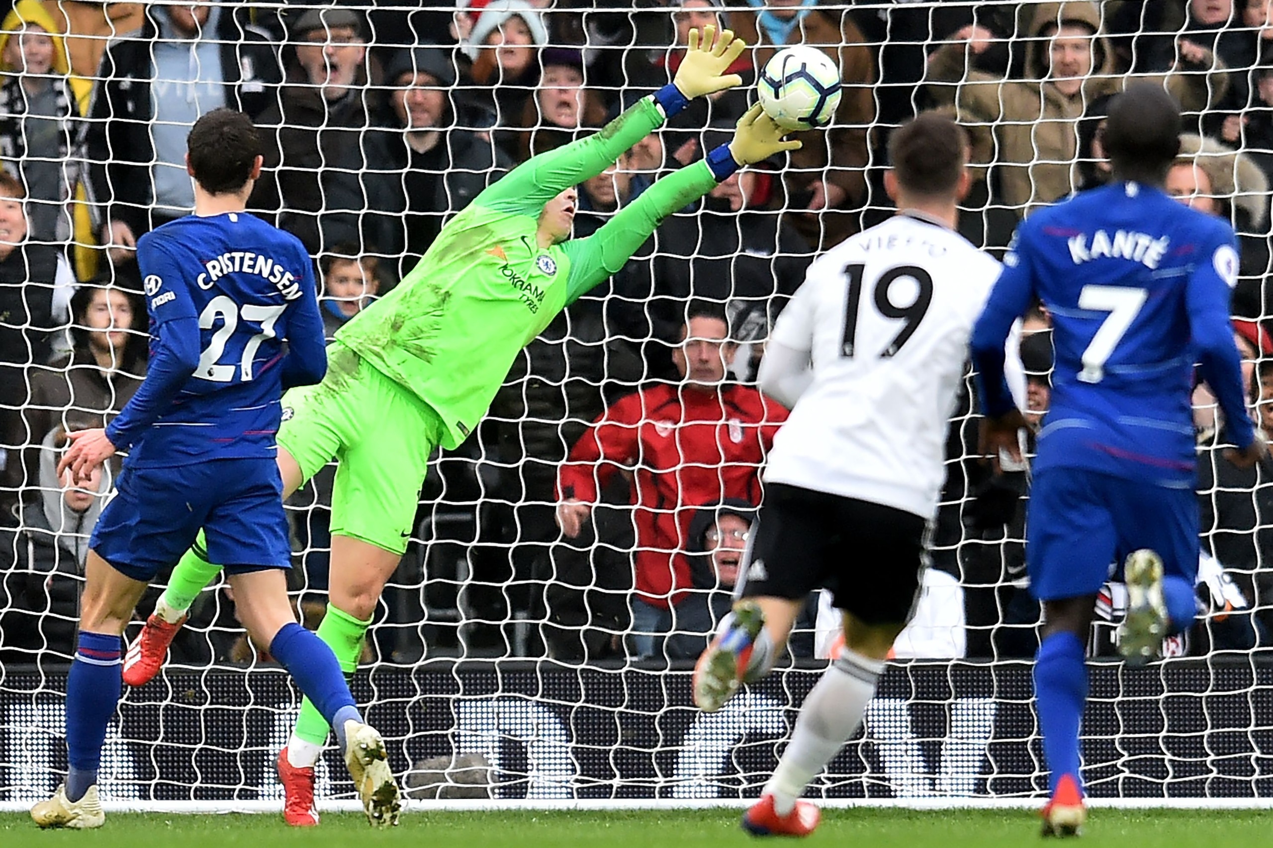 Chelsea's Spanish goalkeeper Kepa Arrizabalaga makes a late save during the English Premier League football match between Fulham and Chelsea at Craven Cottage in London on March 3, 2019. - Chelsea won the game 2-1. (Photo by Glyn KIRK / AFP) / RESTRICTED 