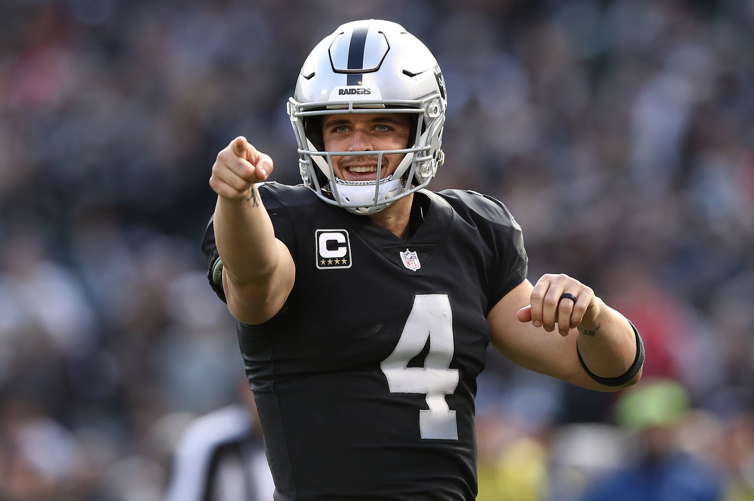 OAKLAND, CA - DECEMBER 02: Derek Carr #4 of the Oakland Raiders celebrates after a touchdown pass against the Kansas City Chiefs during their NFL game at Oakland-Alameda County Coliseum on December 2, 2018 in Oakland, California. (Photo by Ezra Shaw/Getty