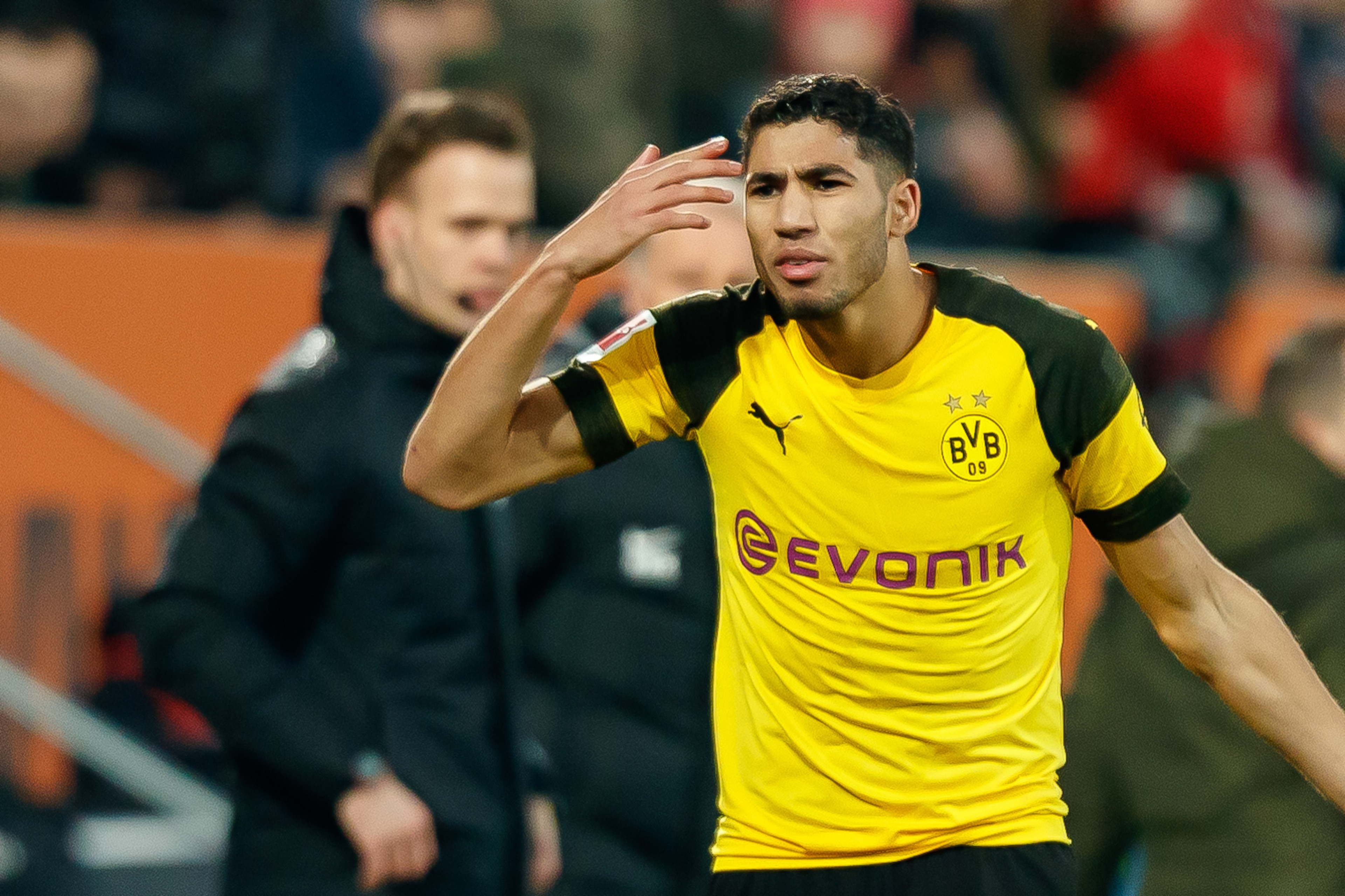 AUGSBURG, GERMANY - MARCH 01: Achraf Hakimi of Borussia Dortmund gestures during the Bundesliga match between FC Augsburg and Borussia Dortmund at WWK-Arena on March 1, 2019 in Augsburg, Germany. (Photo by TF-Images/Getty Images) AUGSBURG, GERMANY - MARCH 01: Achraf Hakimi of Borussia Dortmund gestures during the Bundesliga match between FC Augsburg and Borussia Dortmund at WWK-Arena on March 1, 2019 in Augsburg, Germany. (Photo by TF-Images/Getty Images)