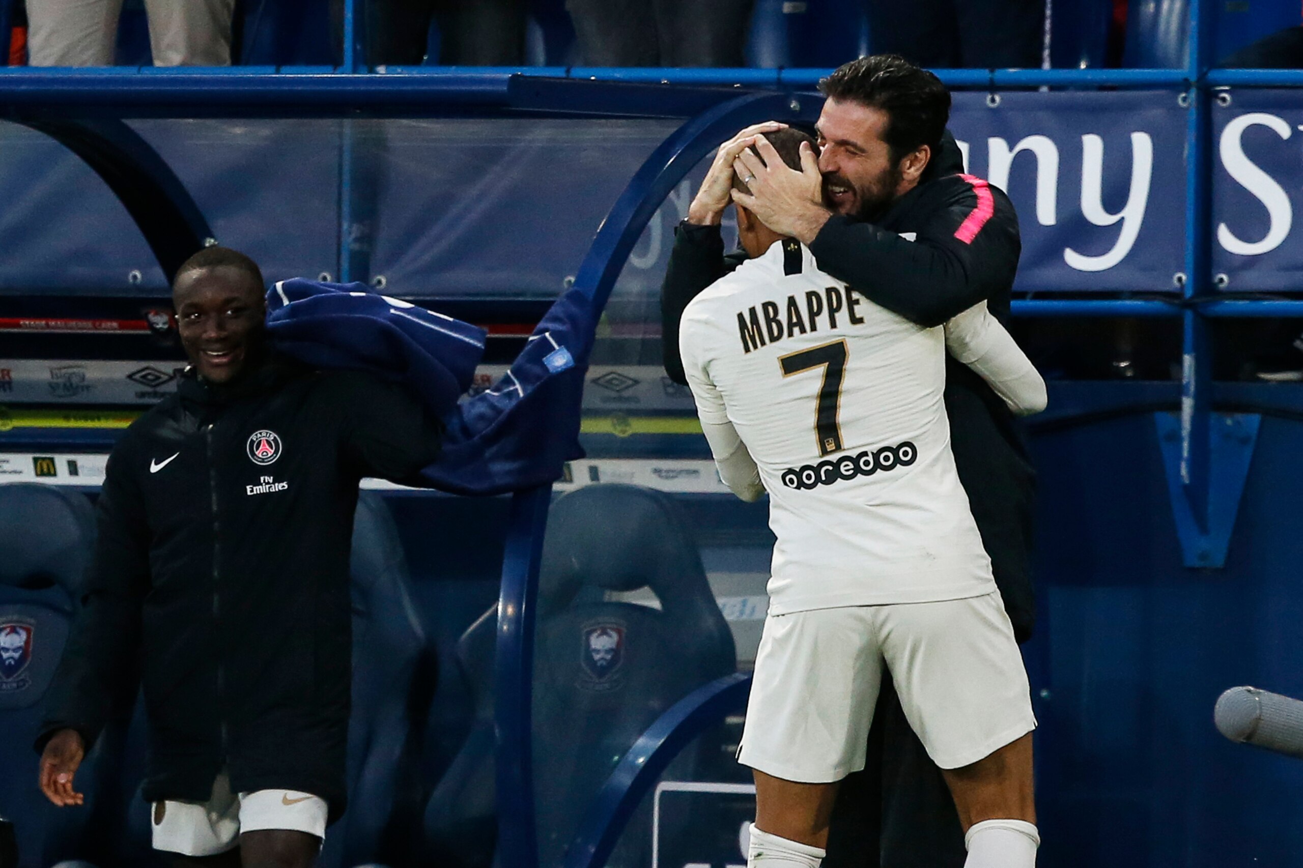TOPSHOT - Paris Saint-Germain's French forward Kylian Mbappe (C) celebrates with Paris Saint-Germain's Italian goalkeeper Gianluigi Buffon (R) after scoring his second goal during the French L1 football match between Caen (SMC) and Paris Saint-Germain (P TOPSHOT - Paris Saint-Germain's French forward Kylian Mbappe (C) celebrates with Paris Saint-Germain's Italian goalkeeper Gianluigi Buffon (R) after scoring his second goal during the French L1 football match between Caen (SMC) and Paris Saint-Germain (P