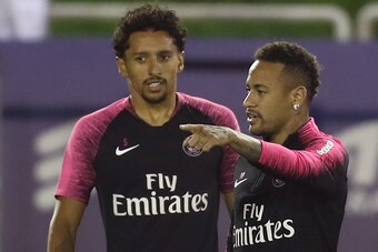 Paris Saint-Germain's Brazilian defender Marquinhos and Paris Saint-Germain's Brazilian forward Neymar (R) take part in the team's winter training camp at the Khalifa International Stadium in the Qatari capital Doha on January 16, 2019. (Photo by KARIM JA