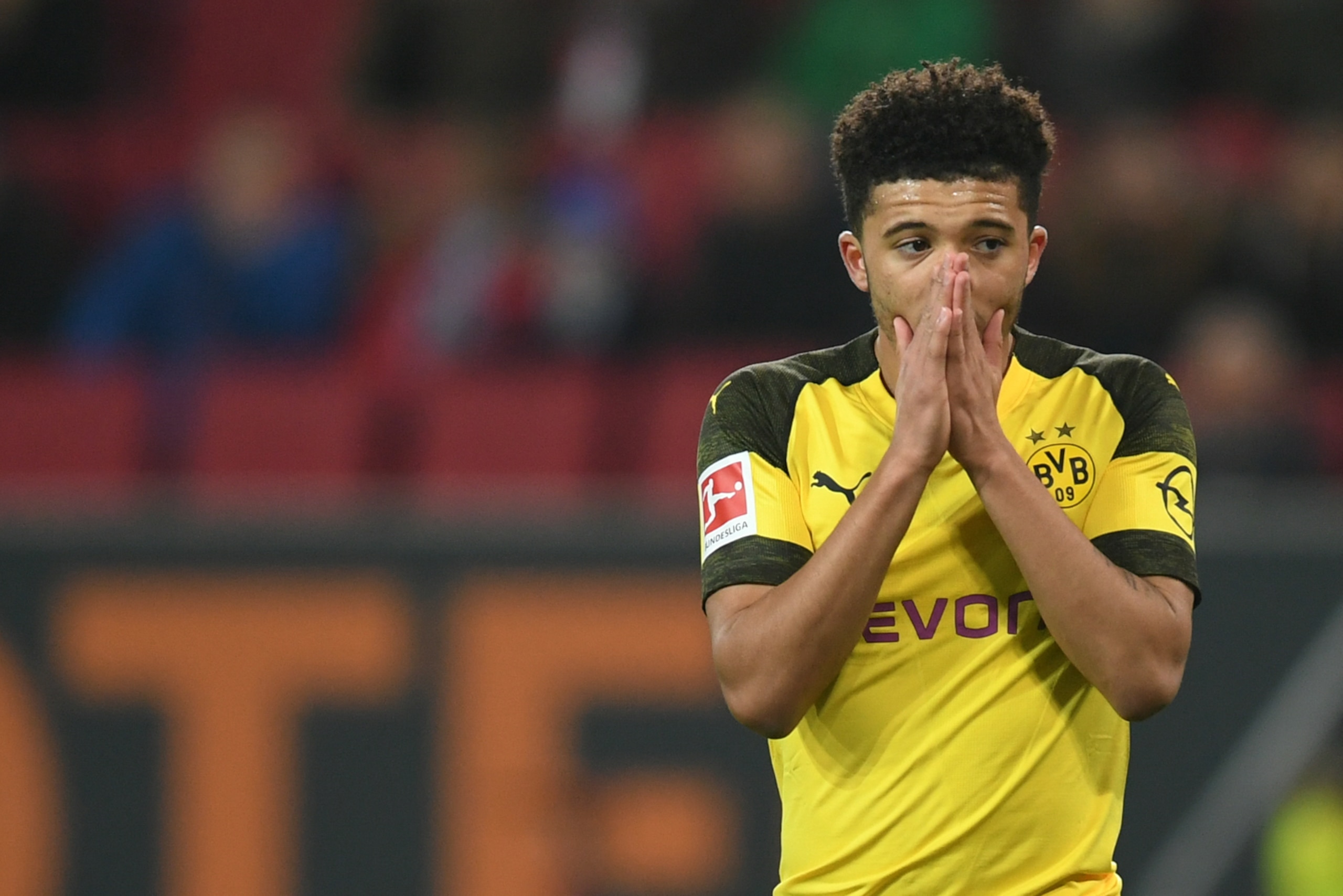 Dortmund's English midfielder Jadon Sancho reacts during the German first division Bundesliga football match between FC Augsburg and Borussia Dortmund in Augsburg, southern Germany on March 1, 2019. (Photo by Christof STACHE / AFP) / RESTRICTIONS: DFL REG