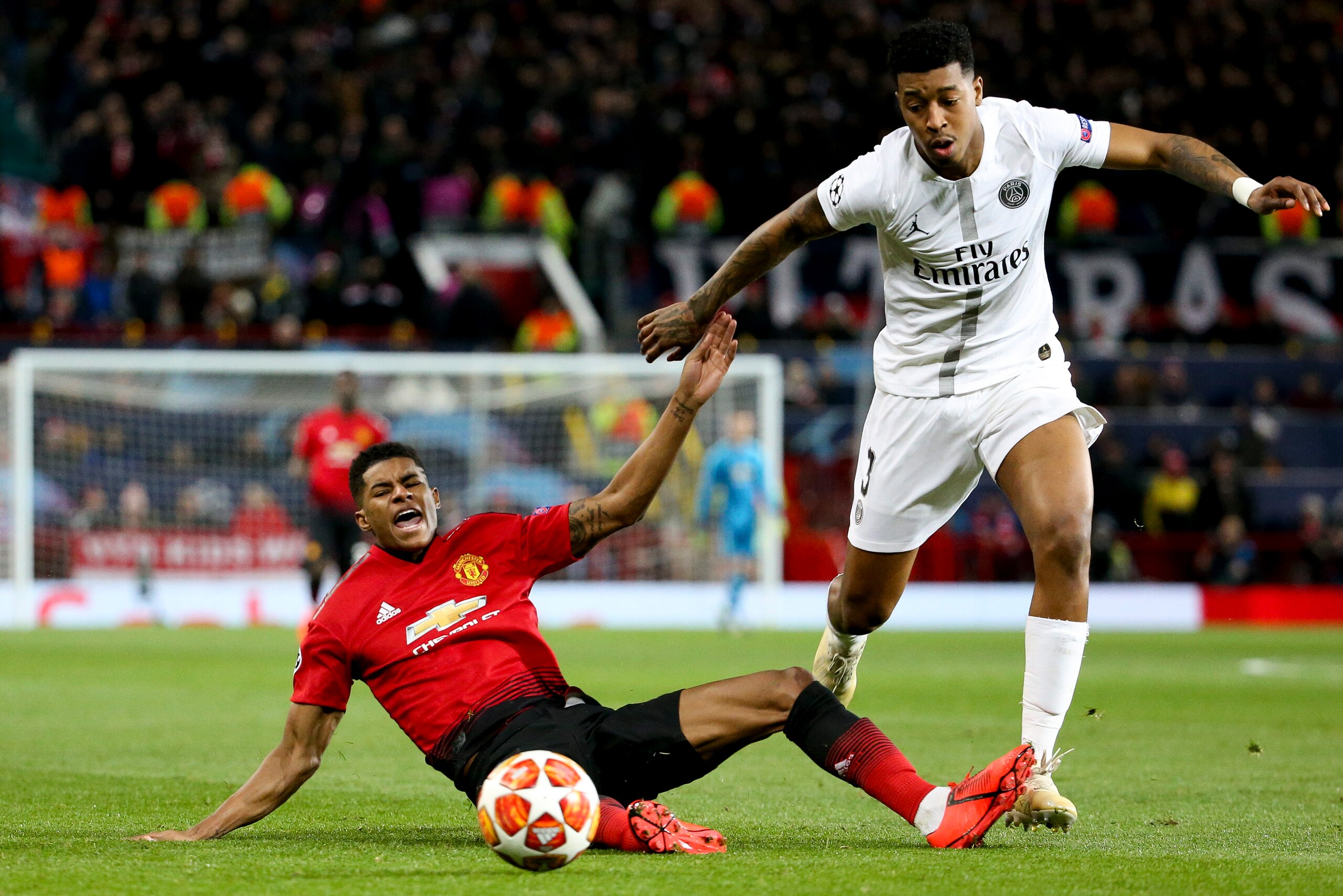 MANCHESTER, ENGLAND - FEBRUARY 12: Marcus Rashford of Manchester United, Presnel Kimpembe of PSG during the UEFA Champions League Round of 16 First Leg match between Manchester United (Man U) and Paris Saint-Germain (PSG) at Old Trafford stadium on Februa