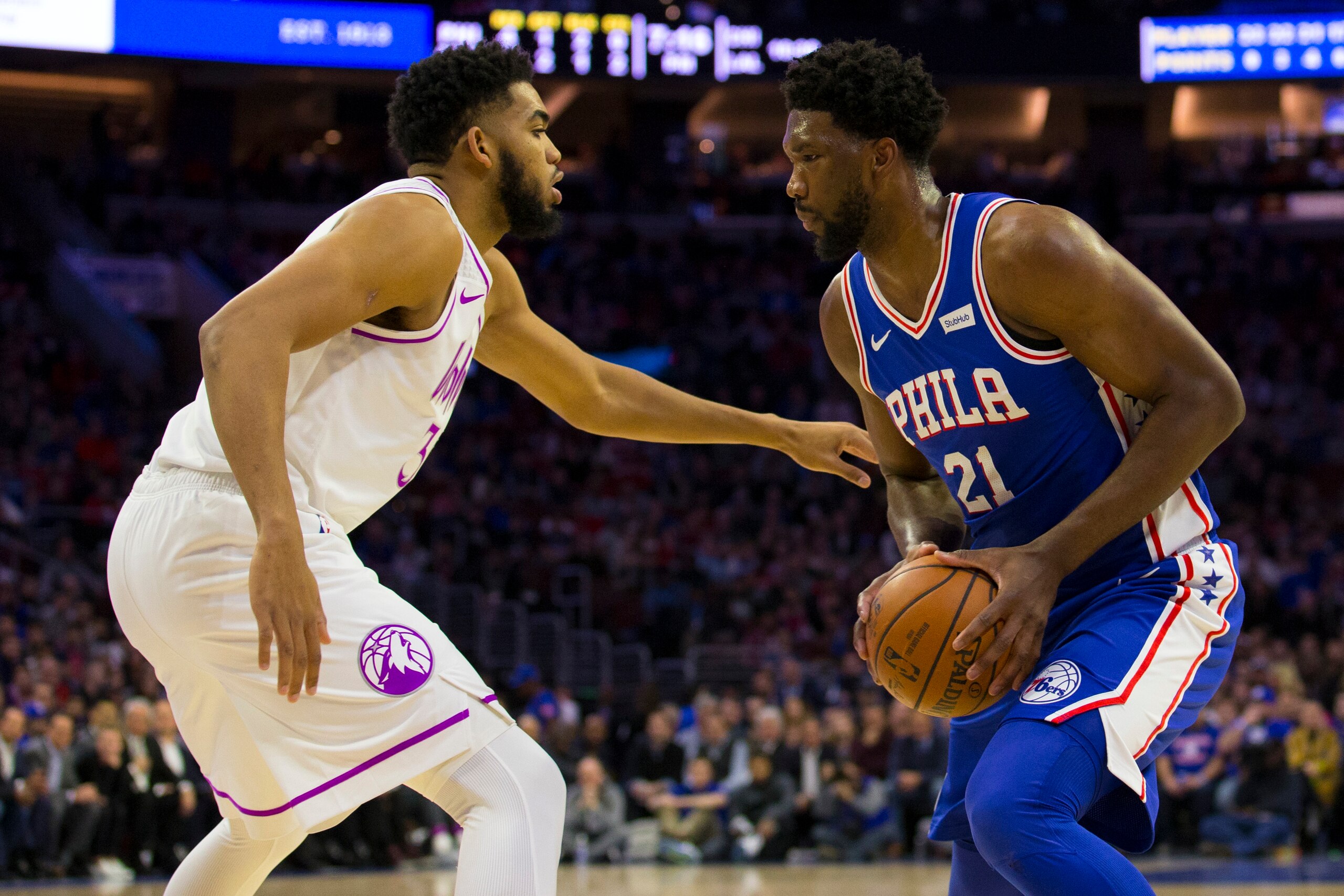 PHILADELPHIA, PA - JANUARY 15: Joel Embiid #21 of the Philadelphia 76ers controls the ball against Karl-Anthony Towns #32 of the Minnesota Timberwolves at the Wells Fargo Center on January 15, 2019 in Philadelphia, Pennsylvania. NOTE TO USER: User express