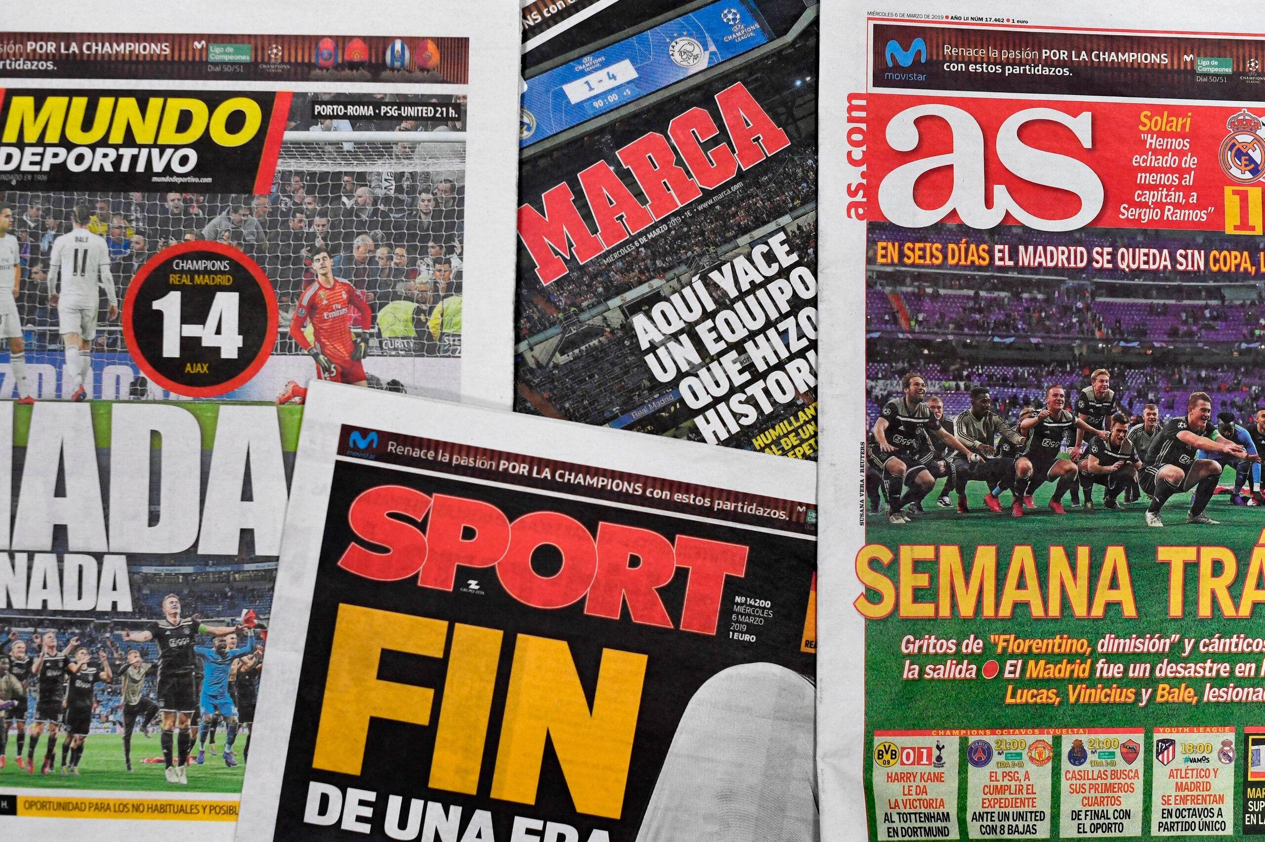 A picture shows the frontpages of Spanish sports newspapers in Madrid on March 6, 2019, a day after Ajax beat Real Madrid 4-1 in the UEFA Champions League round of 16 second leg football match at the Santiago Bernabeu stadium. - The reign of Real Madrid i