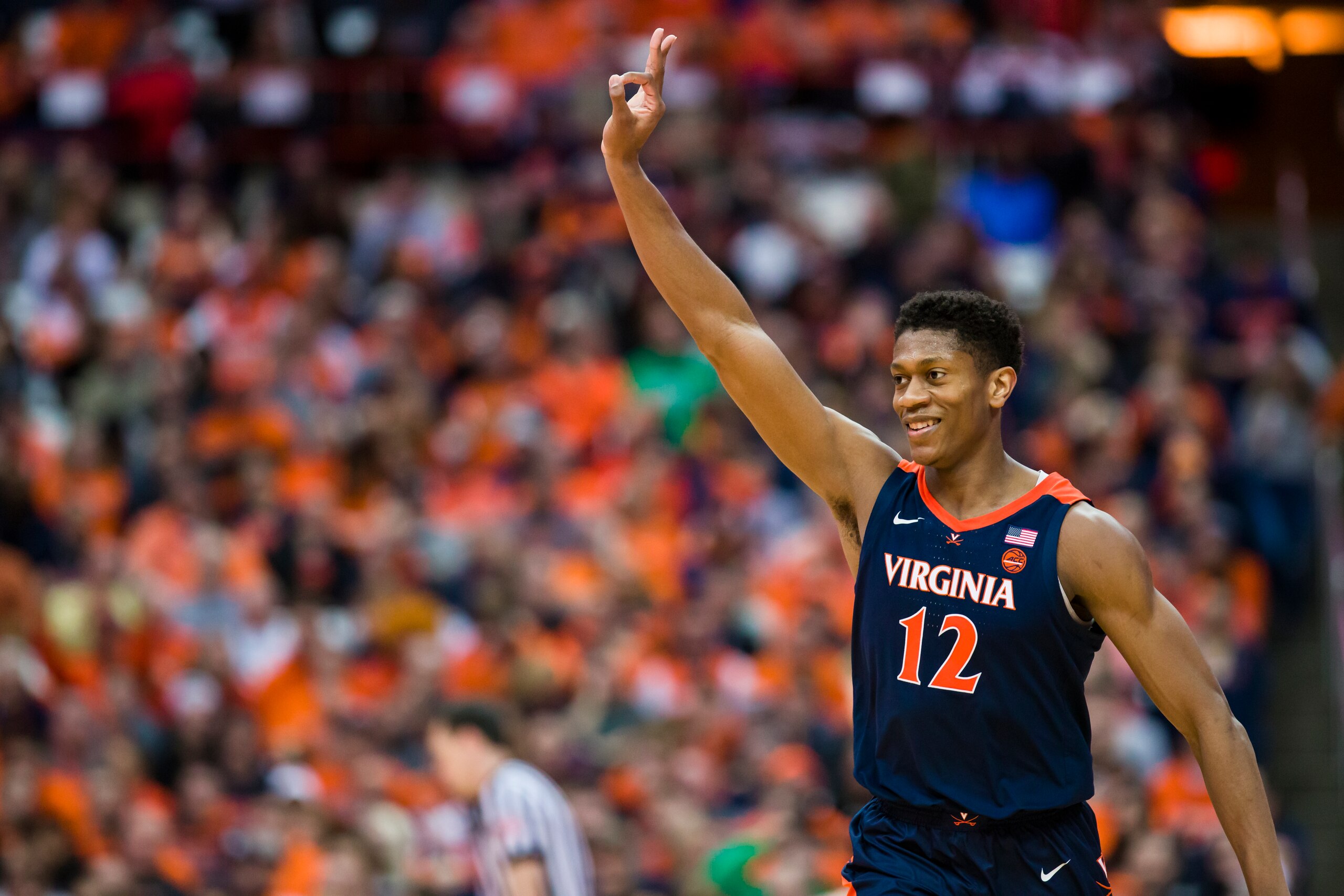 SYRACUSE, NY - MARCH 04: De'Andre Hunter #12 of the Virginia Cavaliers celebrates a teammate's three point basket during the second half against the Syracuse Orange at the Carrier Dome on March 4, 2019 in Syracuse, New York. Virginia defeats Syracuse 79- SYRACUSE, NY - MARCH 04: De'Andre Hunter #12 of the Virginia Cavaliers celebrates a teammate's three point basket during the second half against the Syracuse Orange at the Carrier Dome on March 4, 2019 in Syracuse, New York. Virginia defeats Syracuse 79-