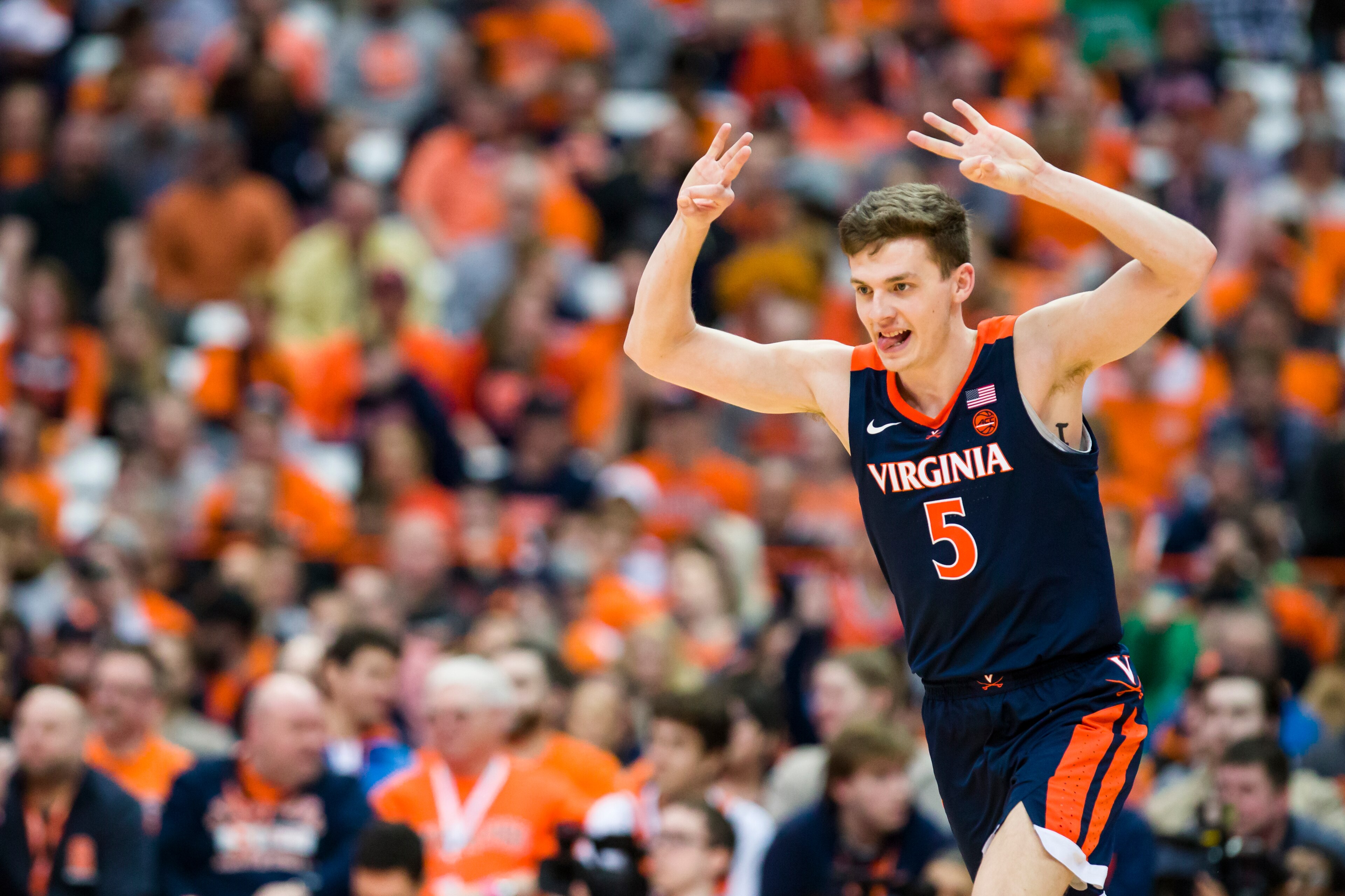 SYRACUSE, NY - MARCH 04:  Kyle Guy #5 of the Virginia Cavaliers celebrates a teammate's three point basket during the second half against the Syracuse Orange at the Carrier Dome on March 4, 2019 in Syracuse, New York. Virginia defeats Syracuse 79-53.  (Ph