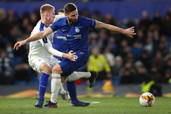 LONDON, ENGLAND - MARCH 07: Mykyta Burda of Dynamo Kyiv and Oliver Giroud of Chelsea during the UEFA Europa League Round of 16 First Leg match between Chelsea and Dynamo Kyiv at Stamford Bridge on March 7, 2019 in London, England. (Photo by James Williams
